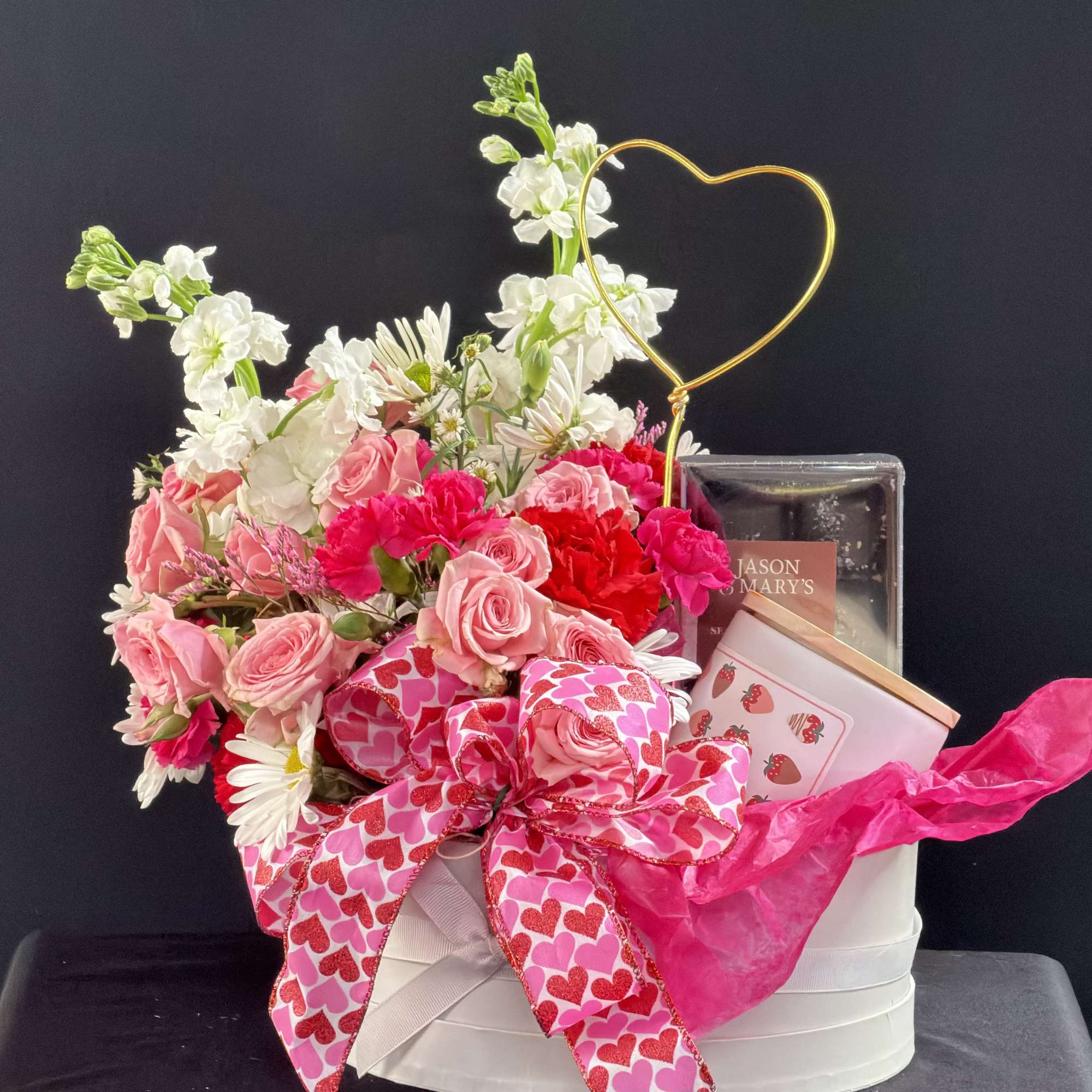 Pink and white flower arrangement in a white gift box with a heart-shaped topper