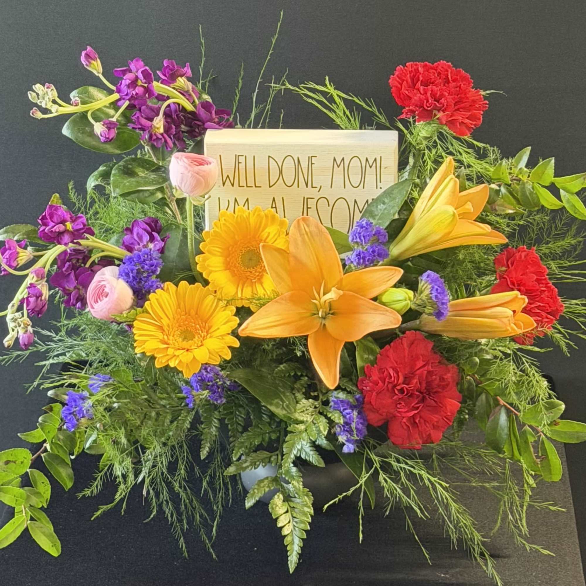 A burst of celebratory color leads the way: large orange lilies crown