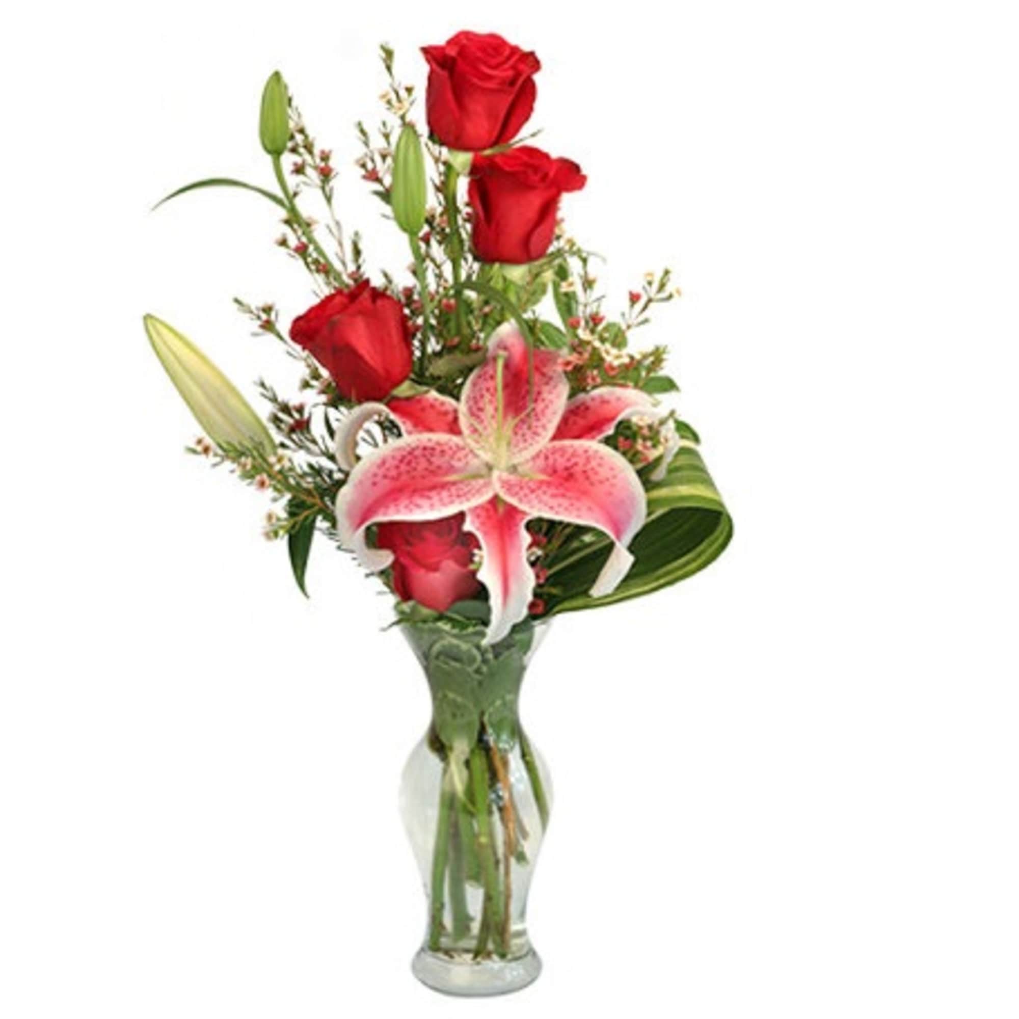 Red roses and pink lilies in a clear glass vase