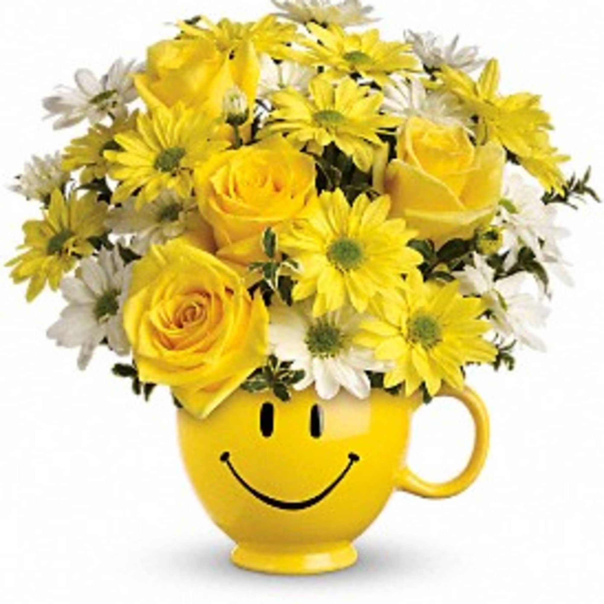 Yellow roses and daisies arranged in a smiley-face mug