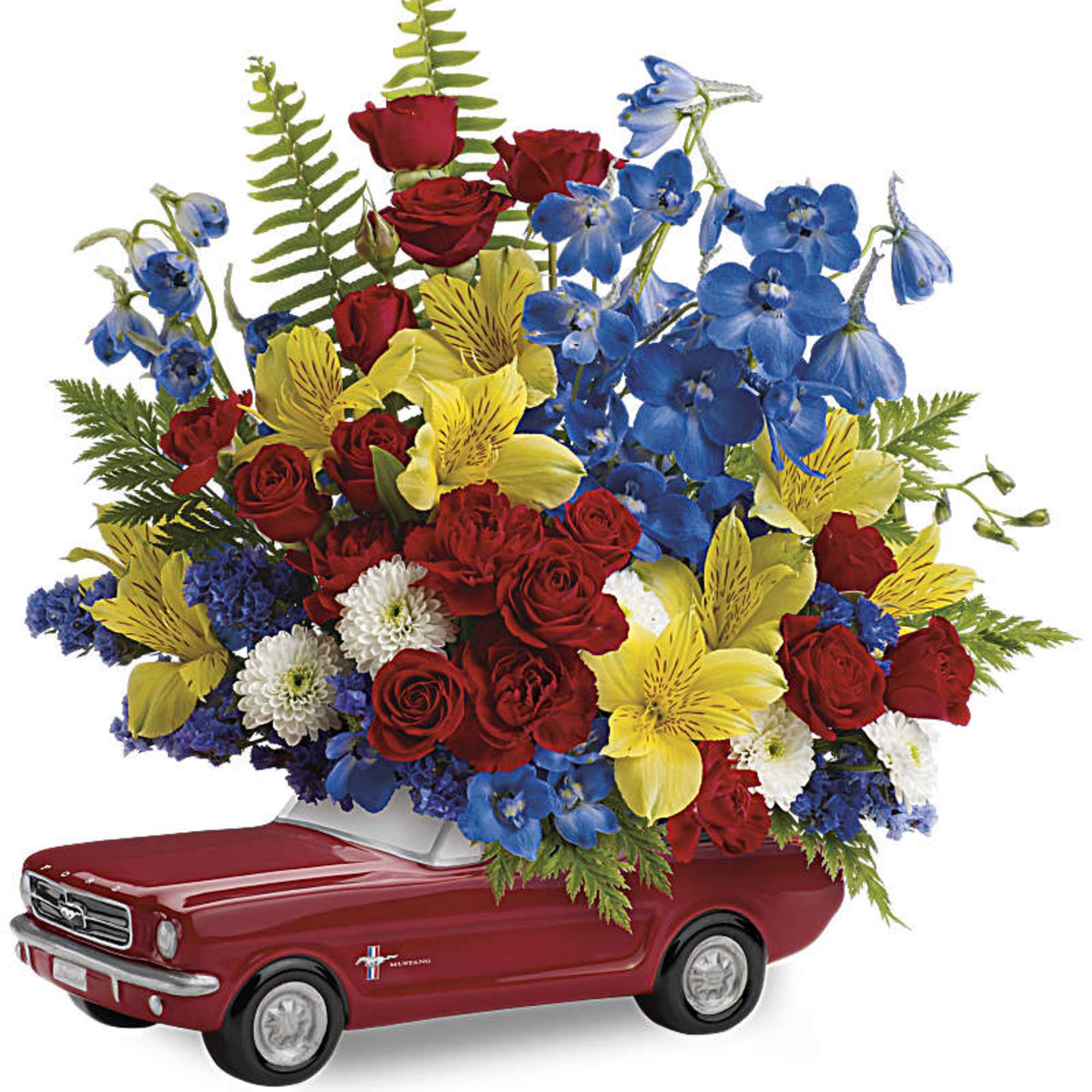 Colorful flower arrangement in a red ceramic car-shaped container.