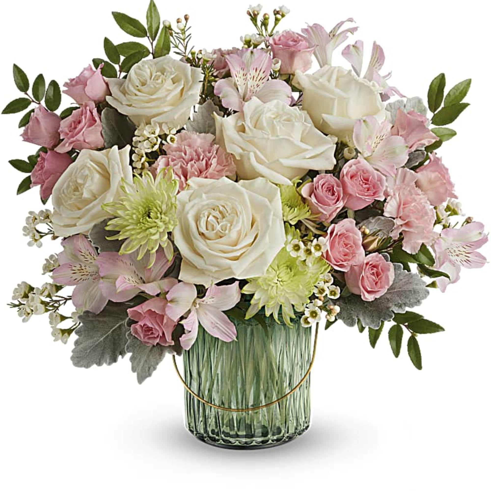 Pastel arrangement of ivory roses and pink blooms in a green glass vase
