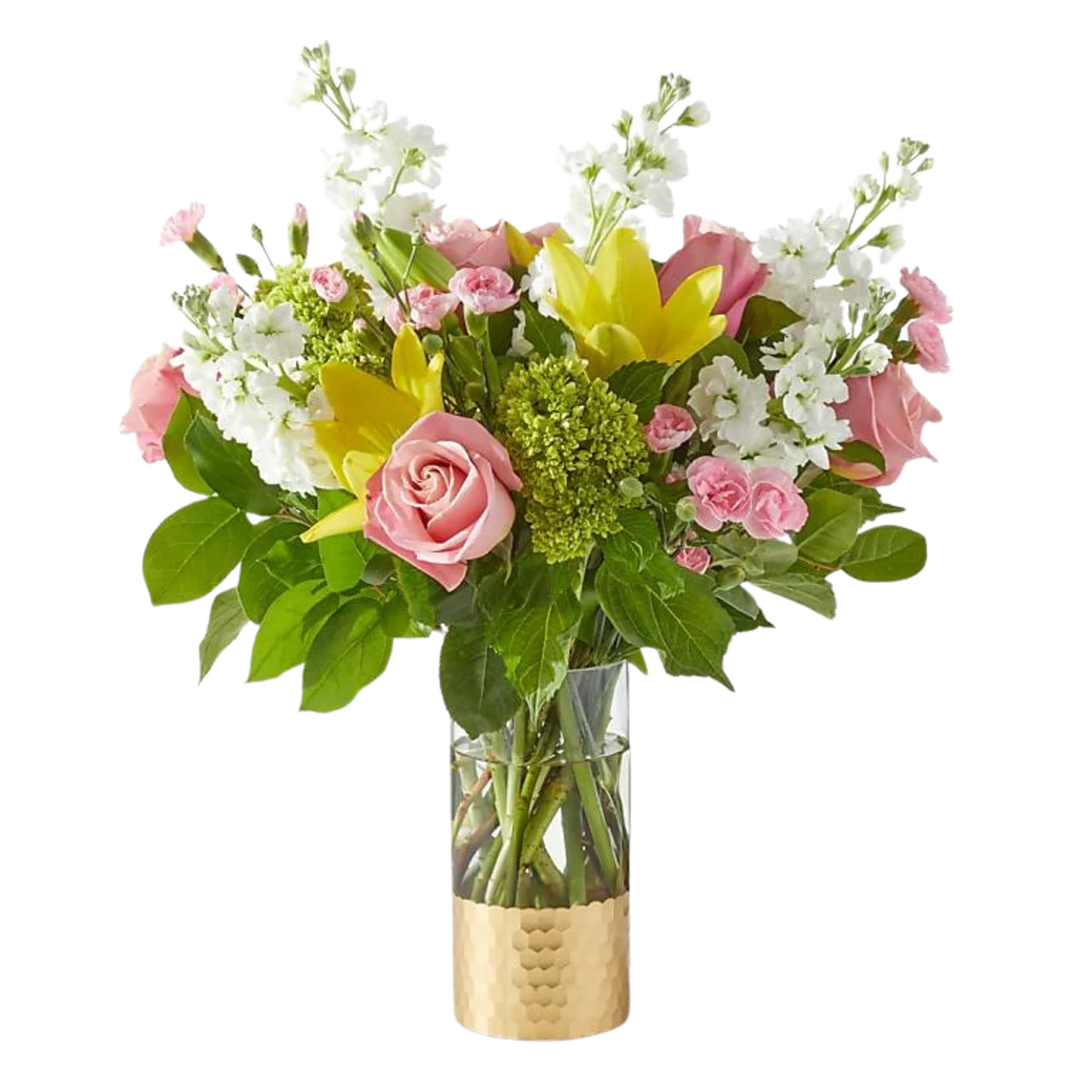 Mixed bouquet of pink roses, yellow lilies, and white flowers in a clear vase with a gold base