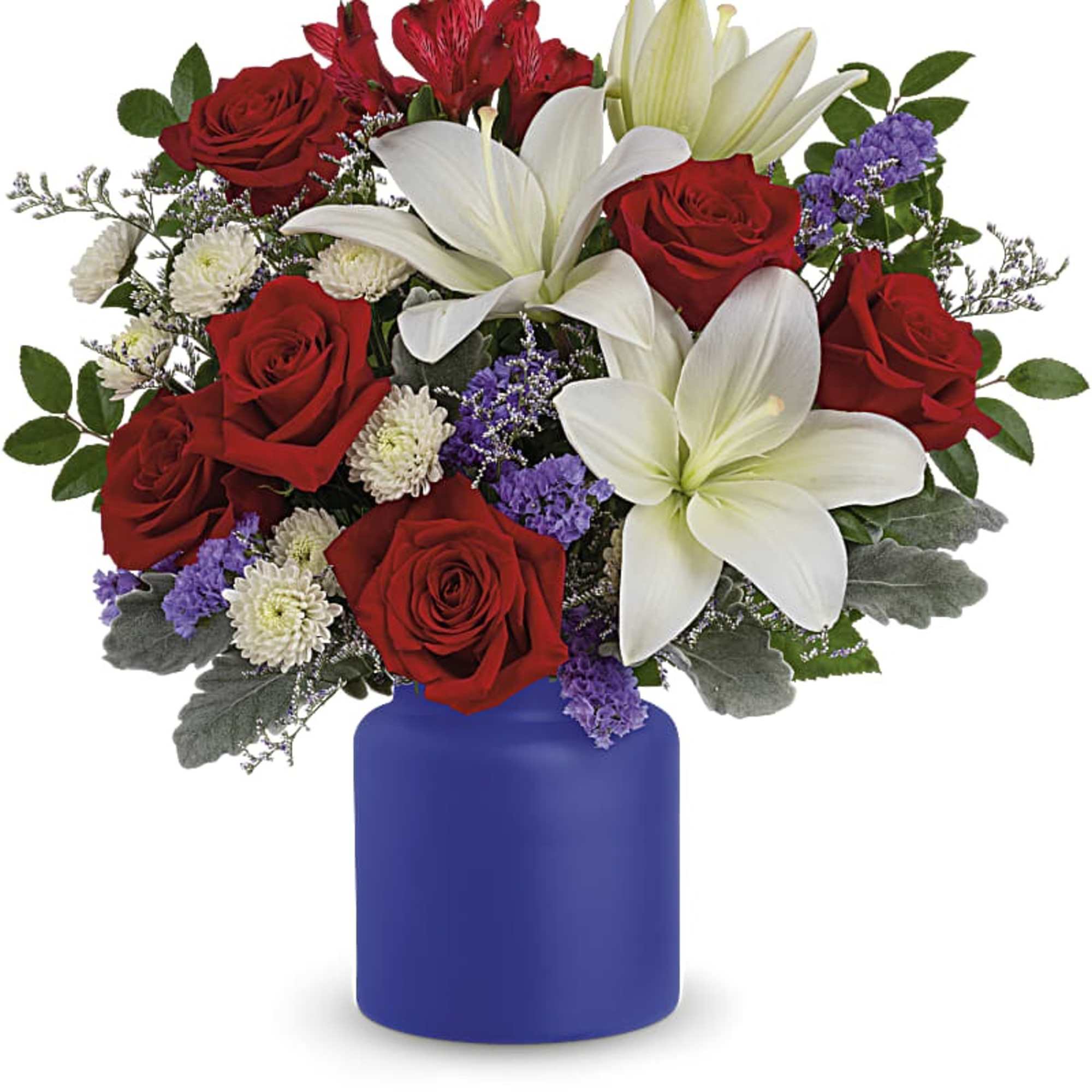 Mixed arrangement of red roses and white lilies in a blue vase