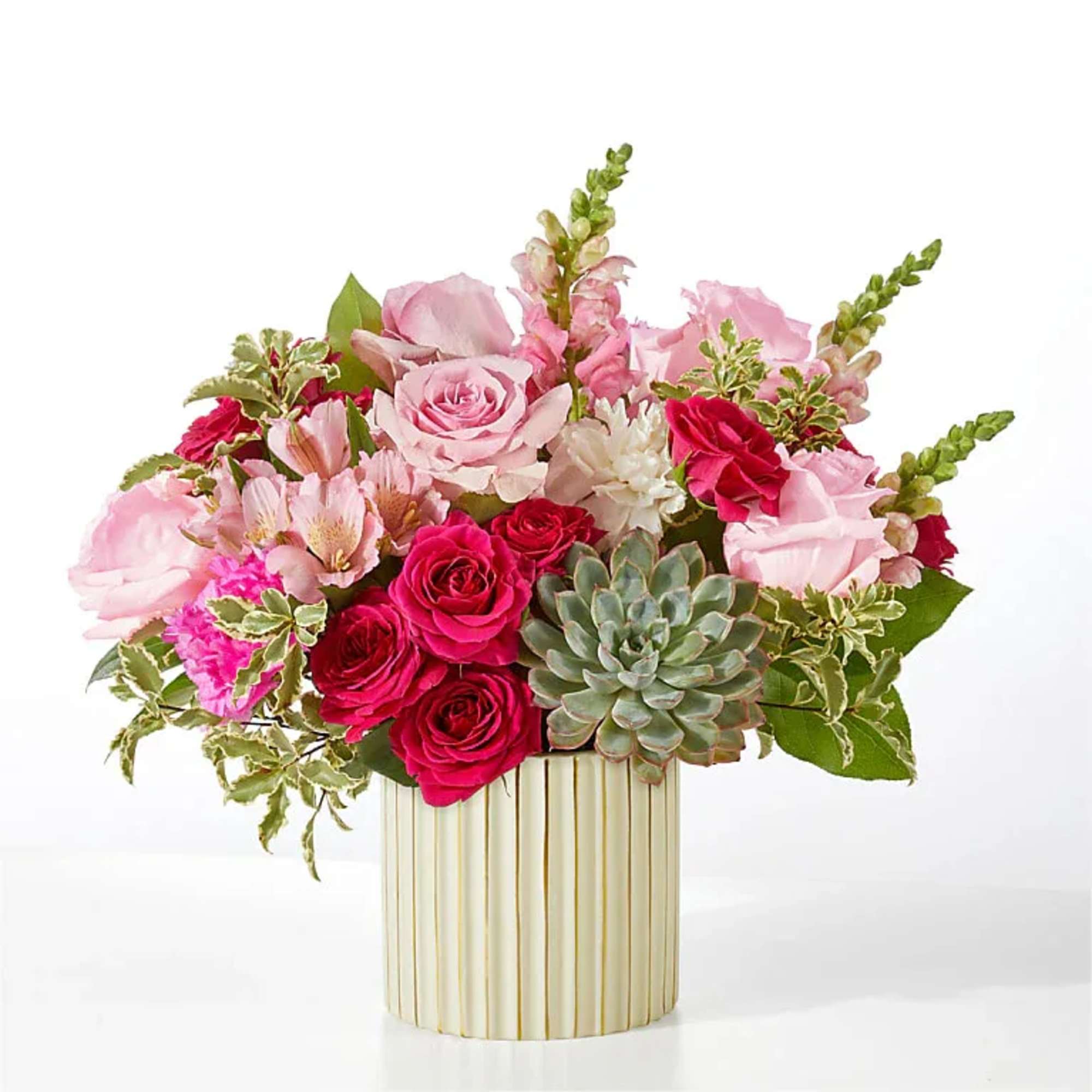 Pale pink roses are combined with pops of hot pink to craft