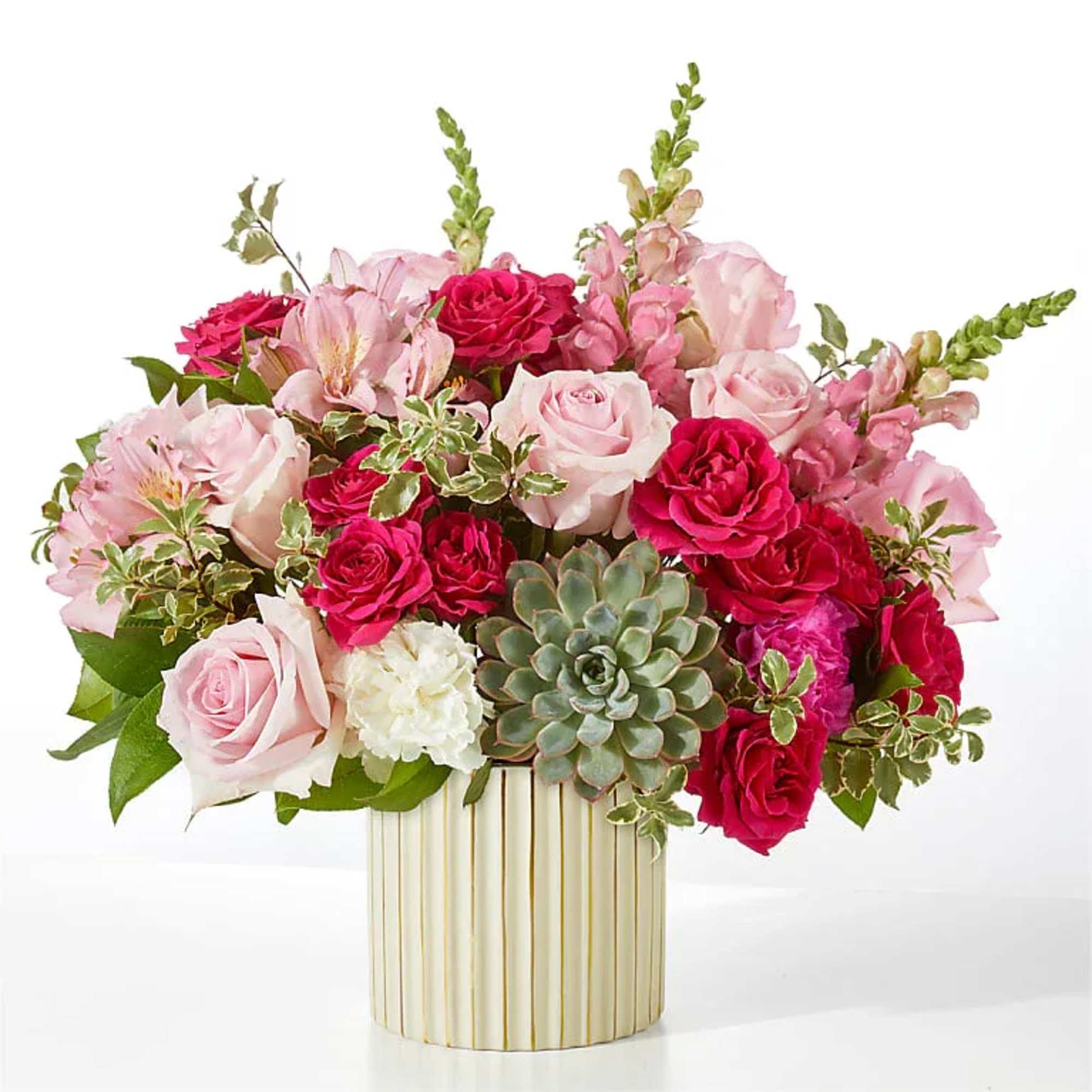 Pale pink roses are combined with pops of hot pink to craft