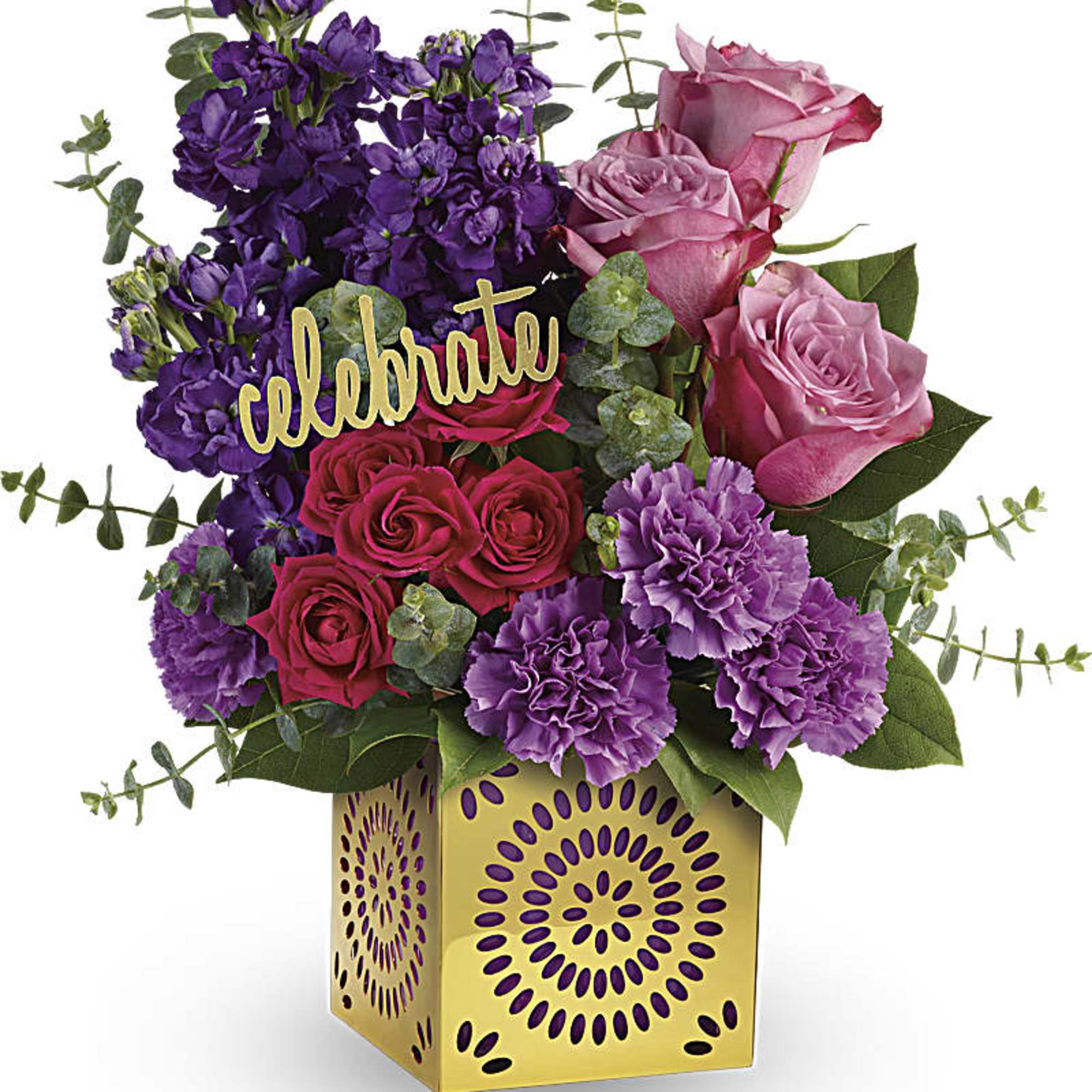Pink and purple flower arrangement in a gold vase with a "celebrate" sign