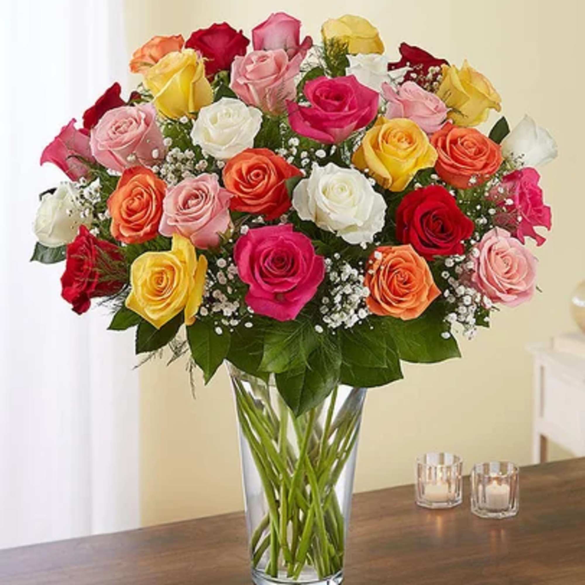 Mixed roses in a clear glass vase