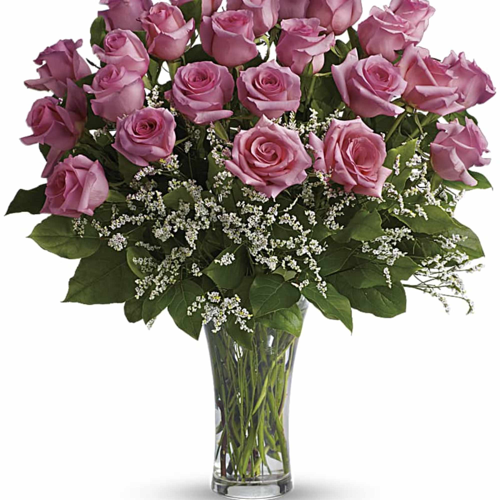 Pink roses arranged in a clear glass vase