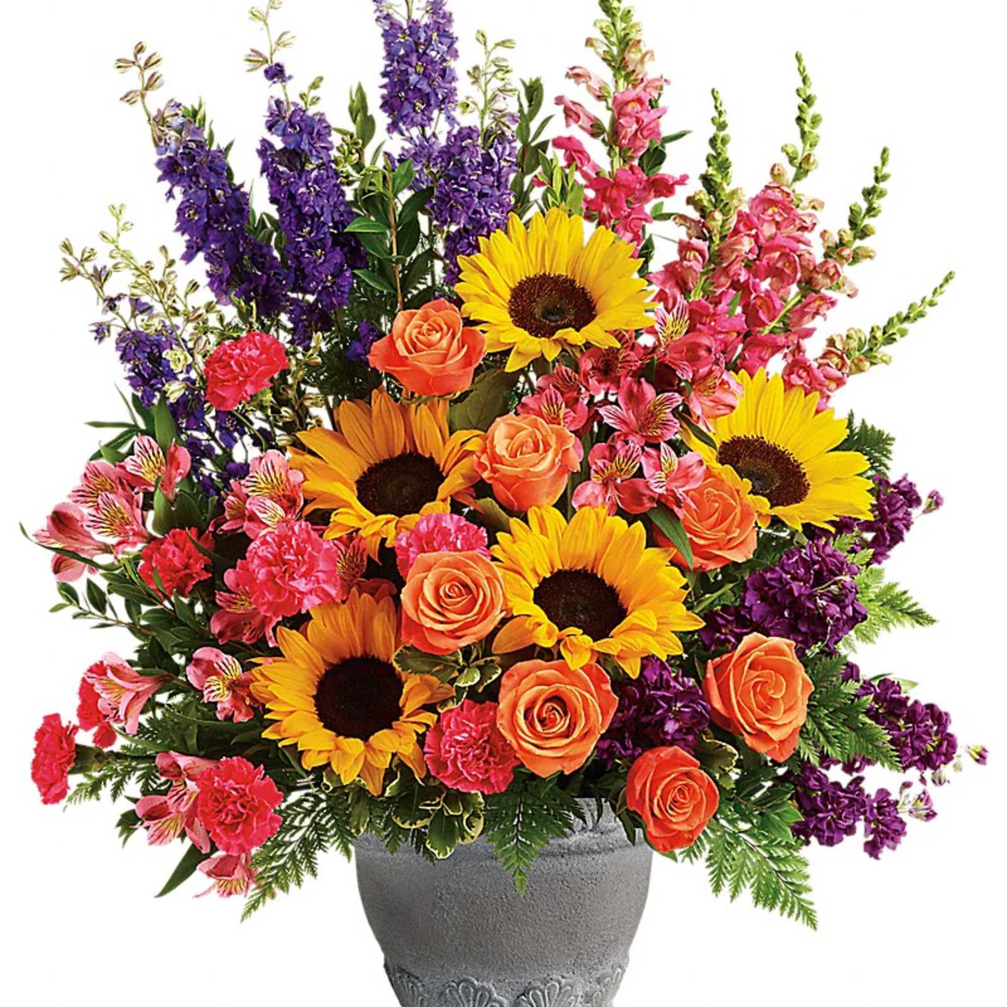 Colorful mixed bouquet in a gray pot with sunflowers and roses