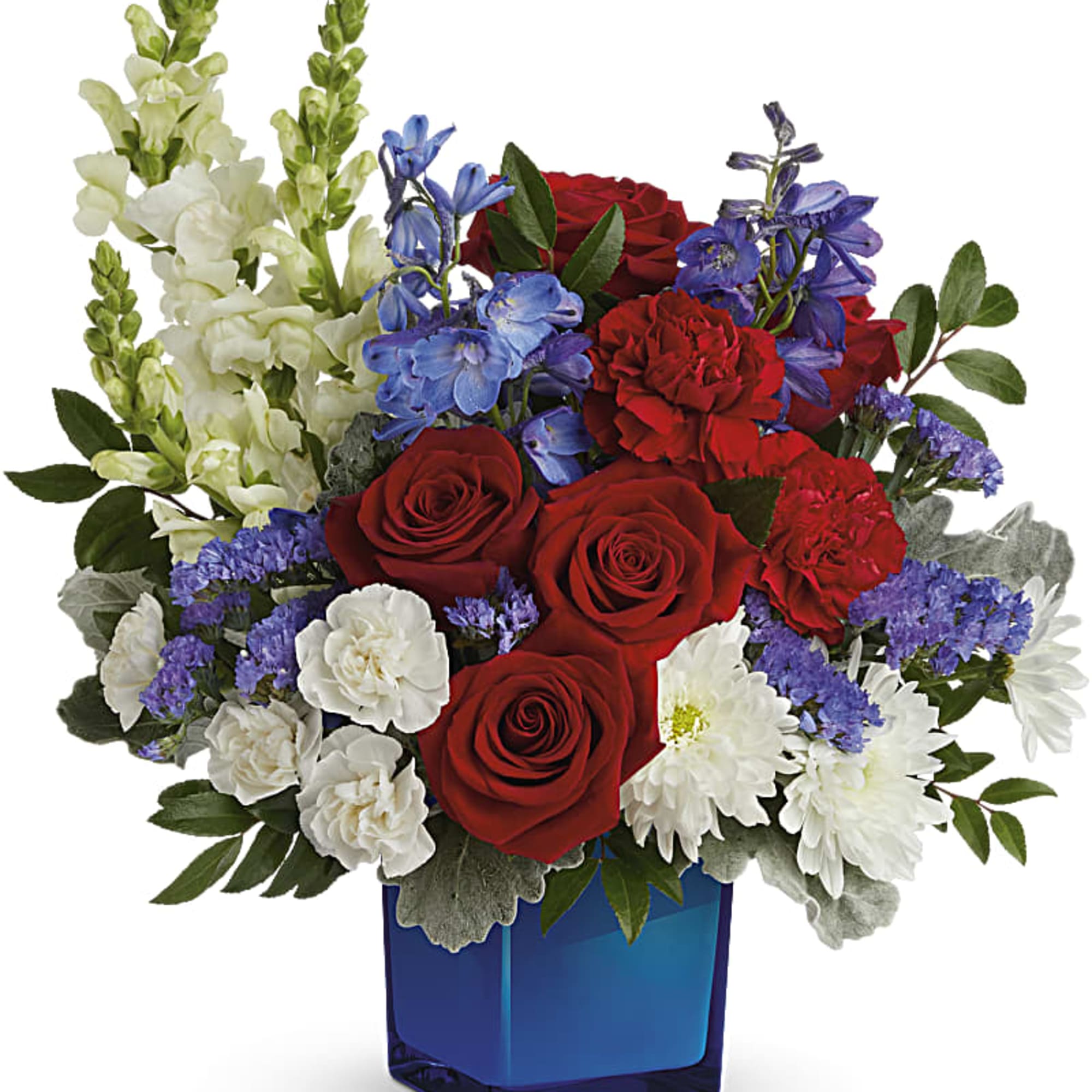 Red roses, white snapdragons, and blue flowers in a blue vase