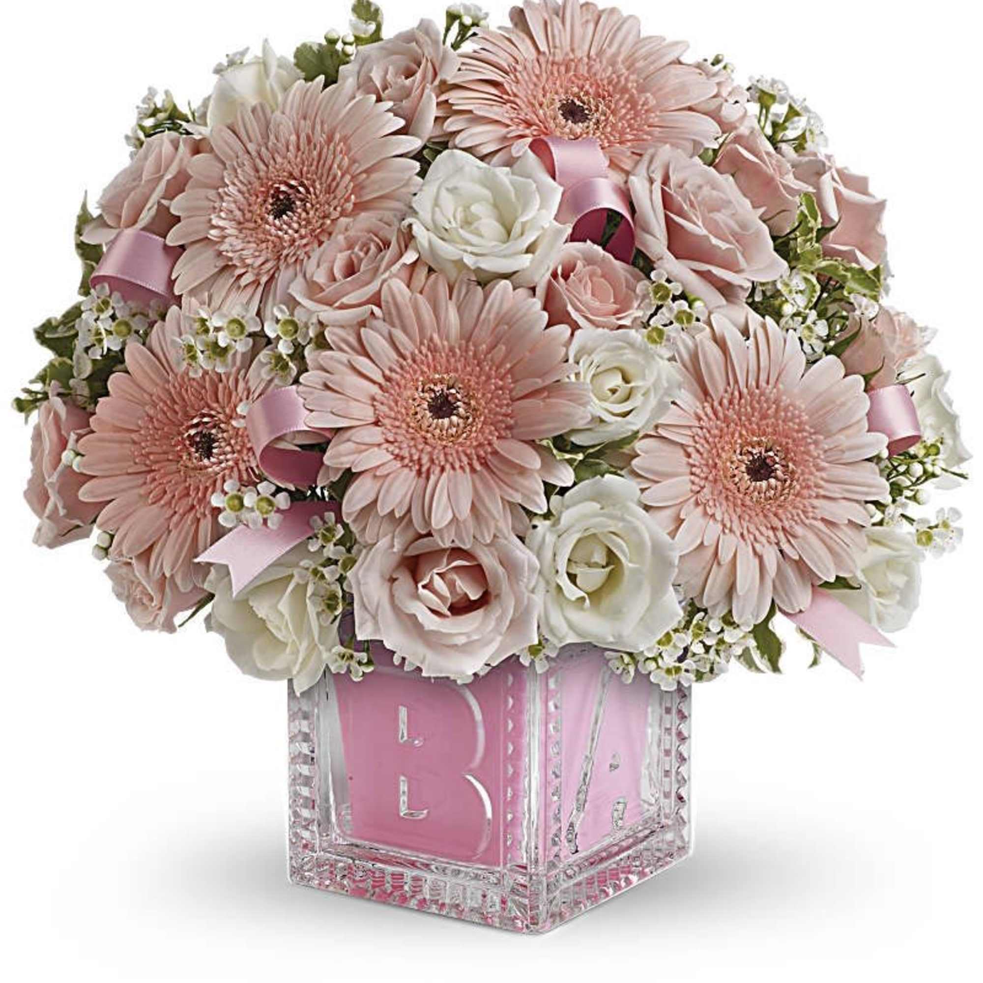Pink and white bouquet in a clear cube vase with a pink "BABY" insert