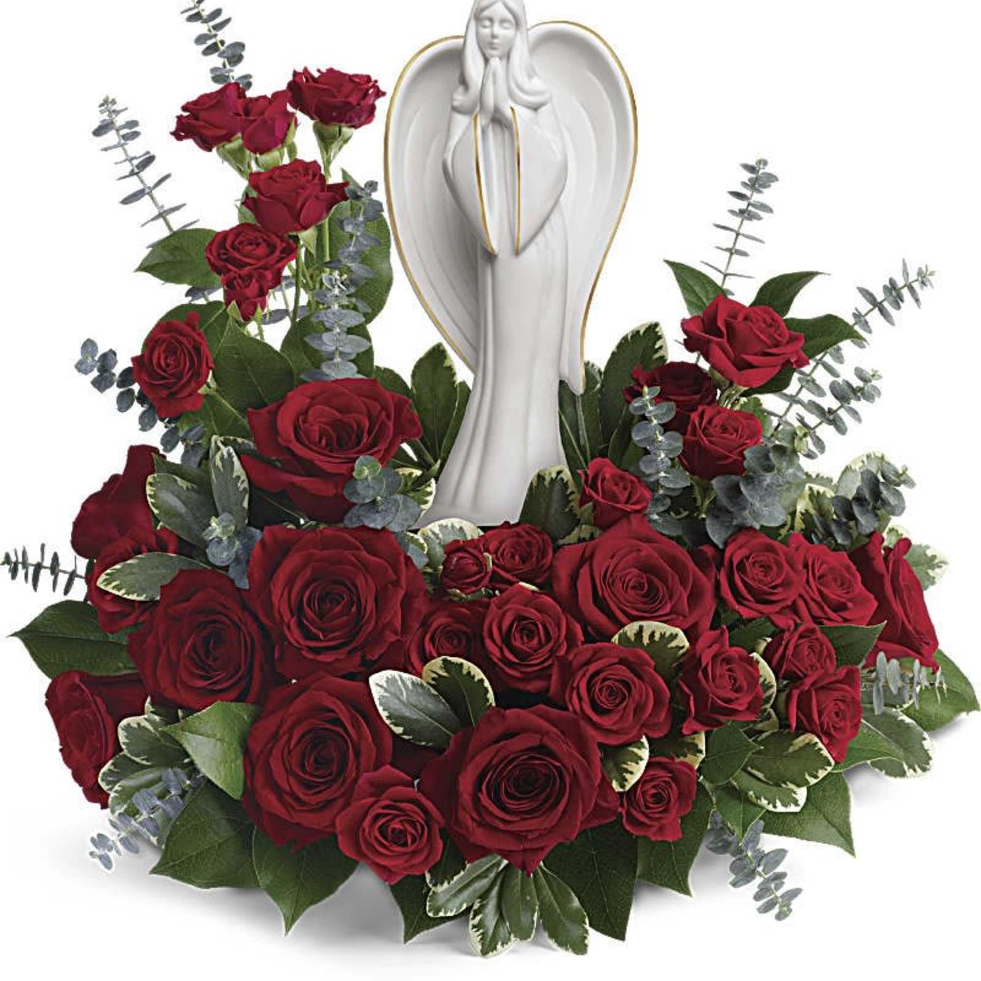 Red roses arranged around a white angel statue