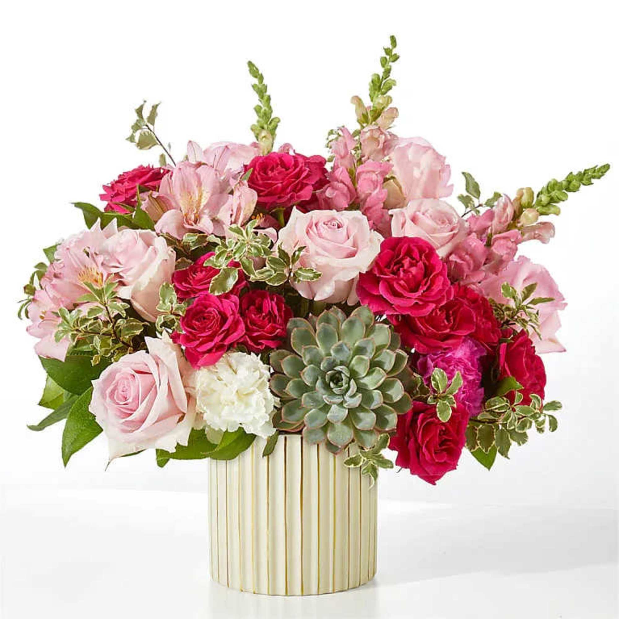 Pink and red rose bouquet in a striped gold vase with a succulent accent