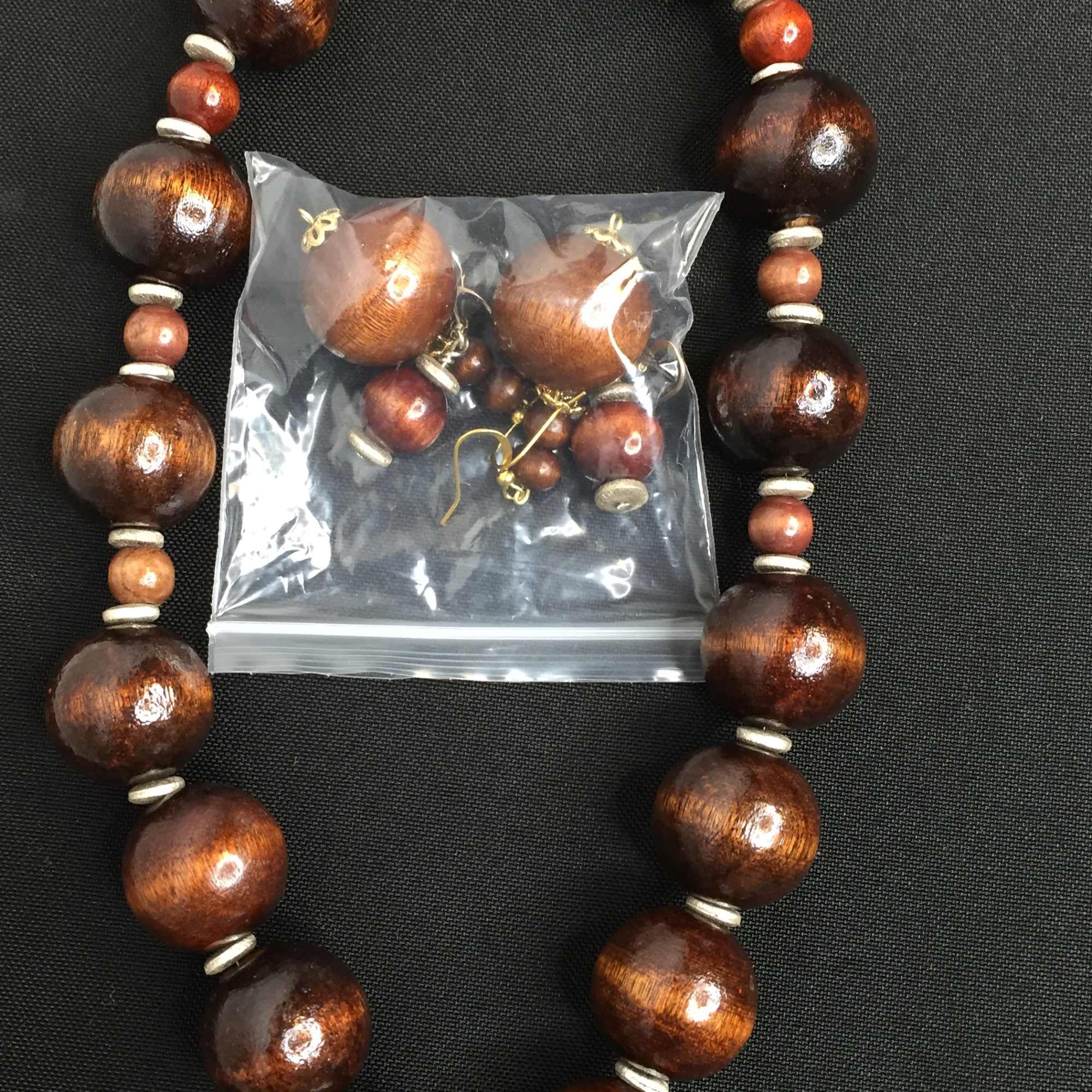 Wood bead necklace with matching earrings in a plastic bag, photo 2 of 2
