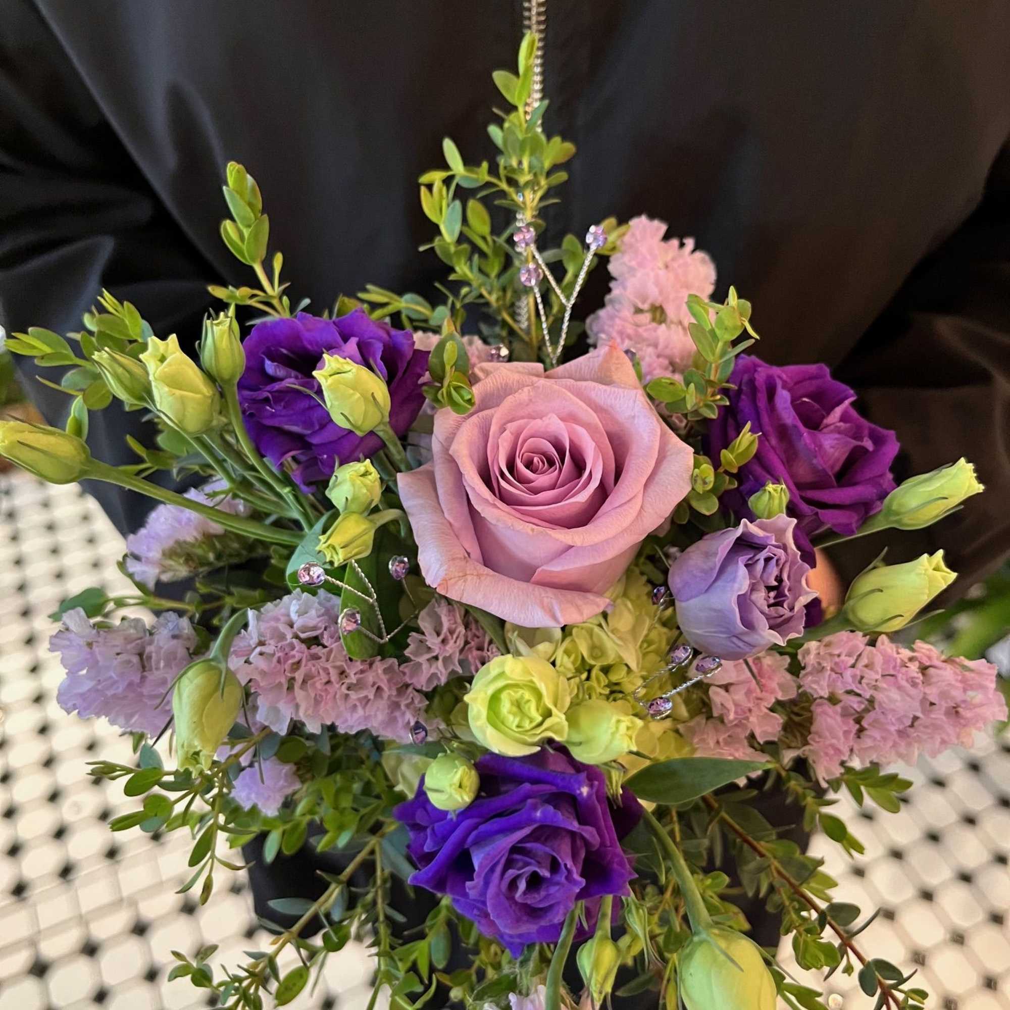 Bouquet of pink and purple roses with lavender filler flowers