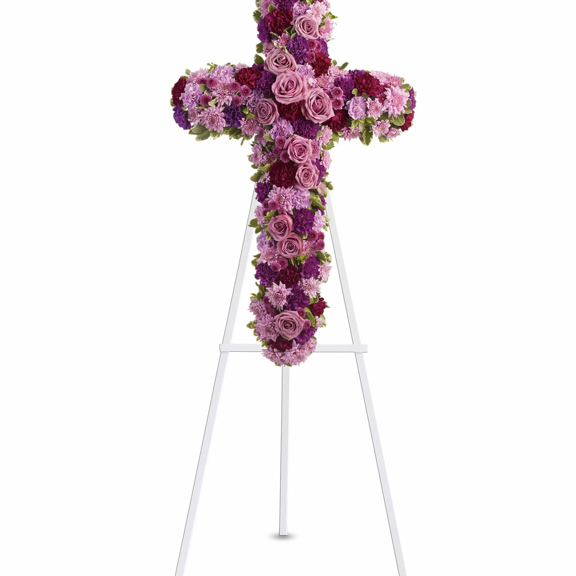 Purple and pink floral cross on a white stand