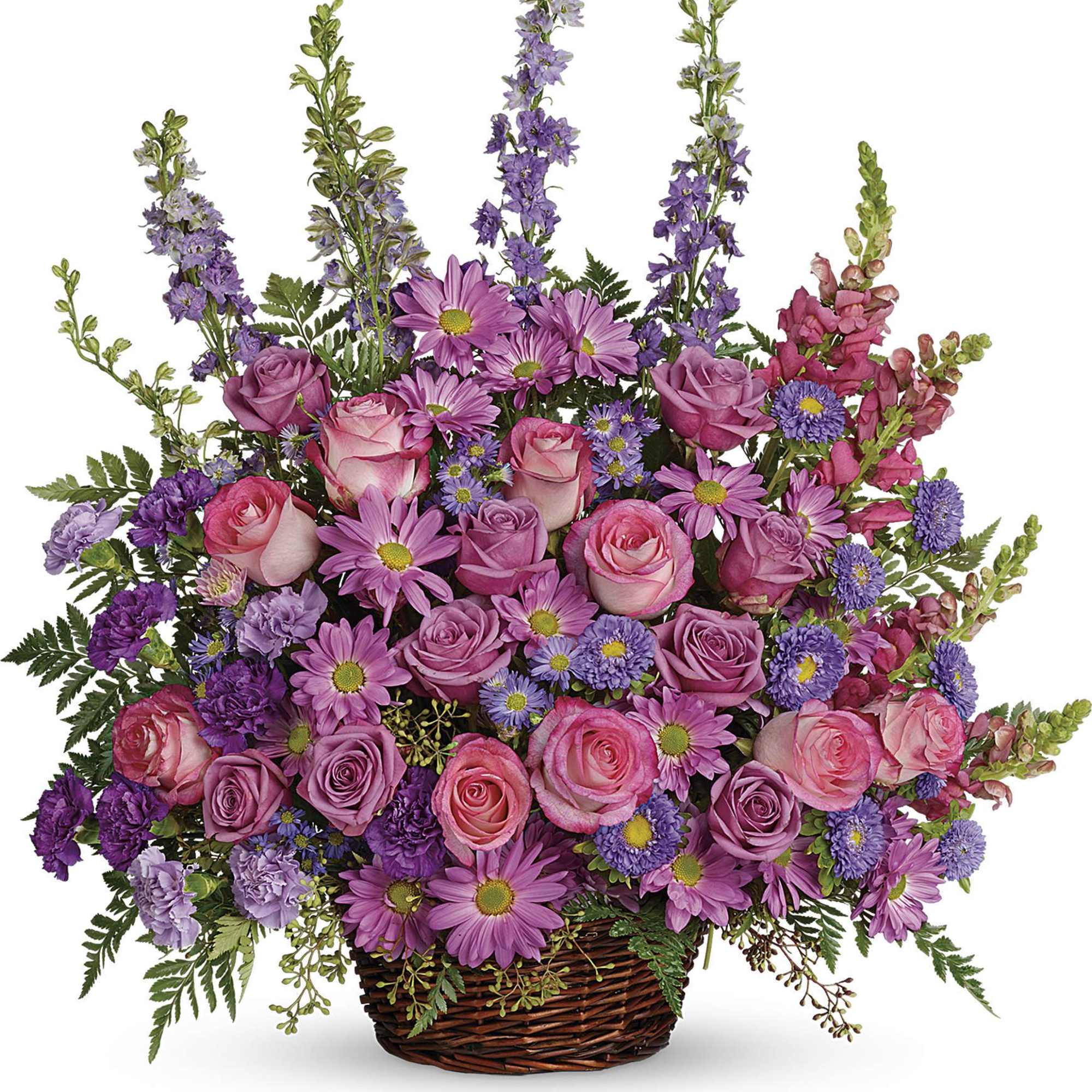 Large basket arrangement of pink roses, lavender daisies, and purple flowers.