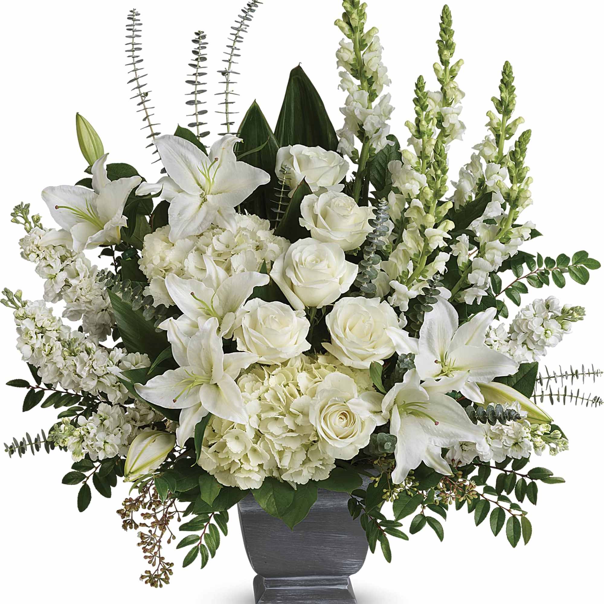 White lilies and roses arranged in a dark vase