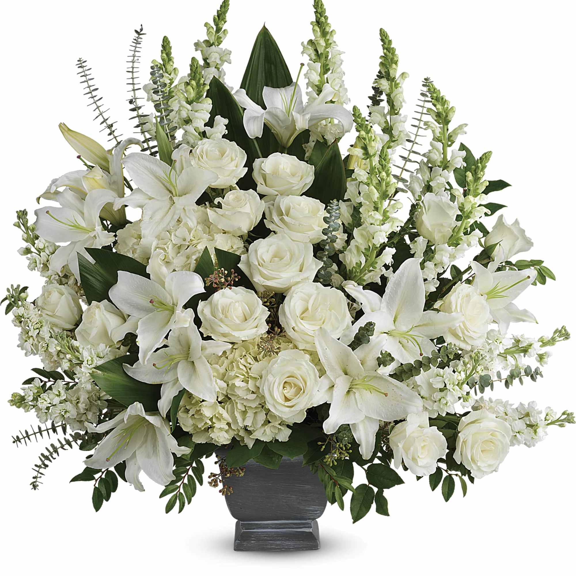 White lilies and roses arranged in a dark vase