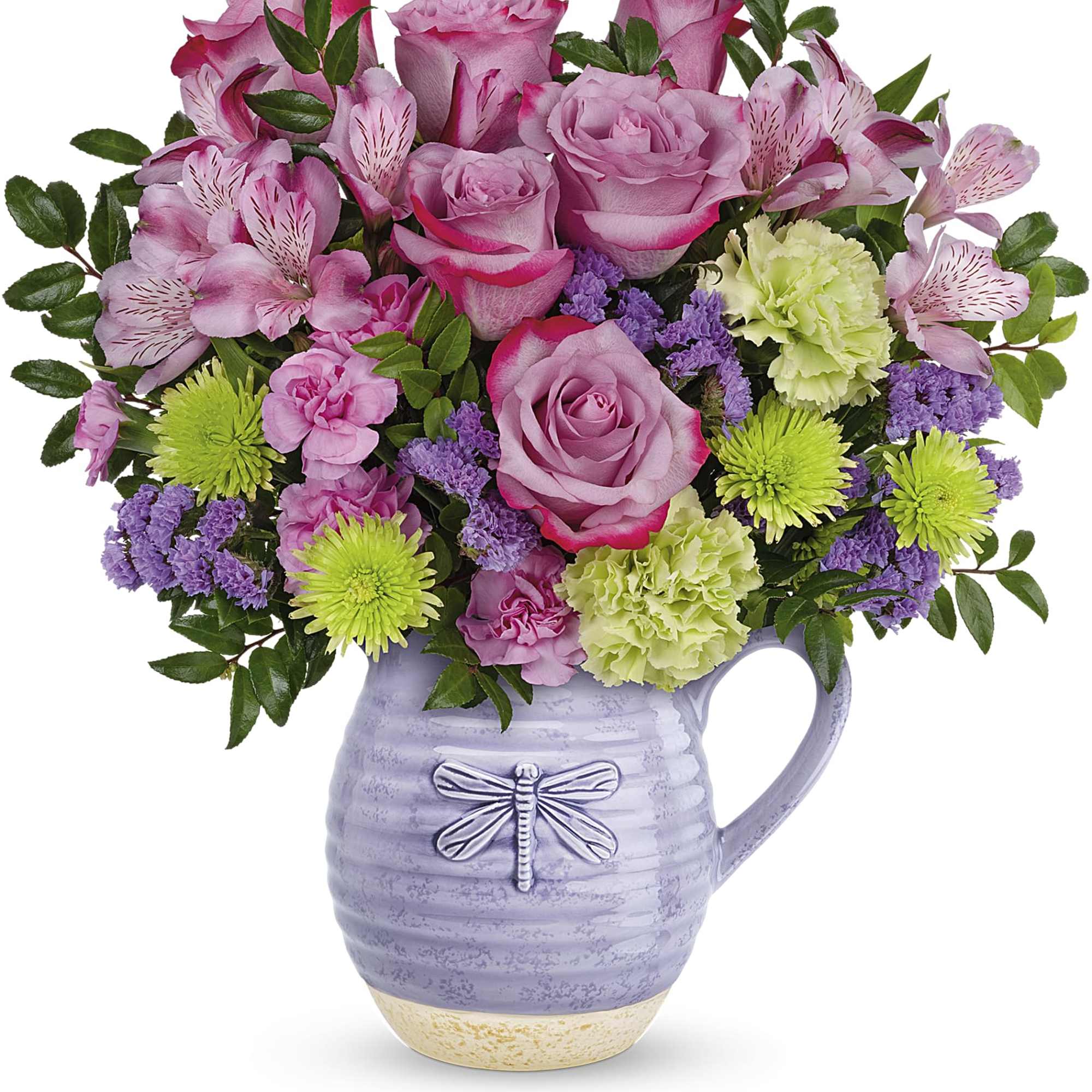 Pink roses and mixed flowers arranged in a lavender pitcher vase