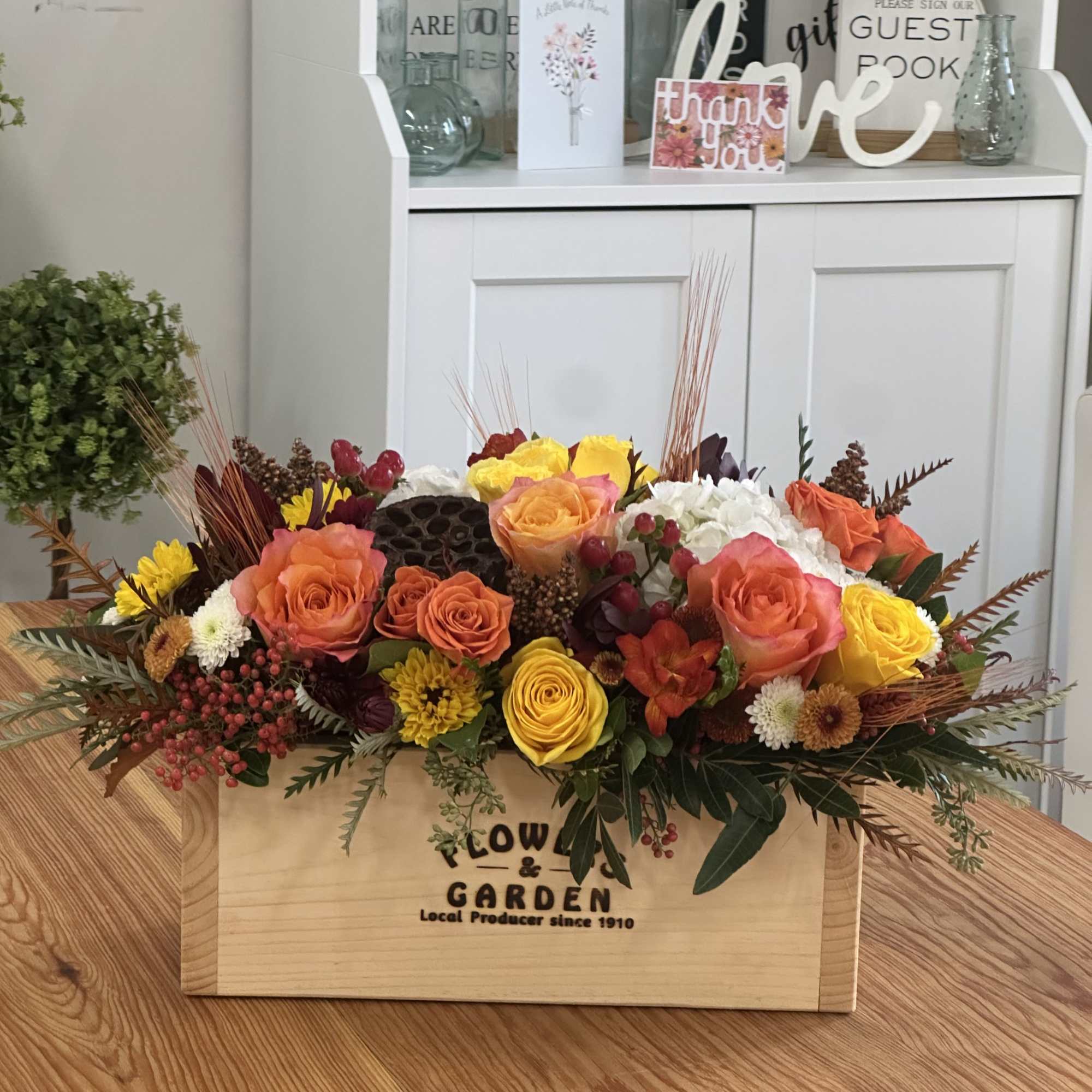 Embrace the warm embrace of fall with the exquisite Autumn Sunset arrangement