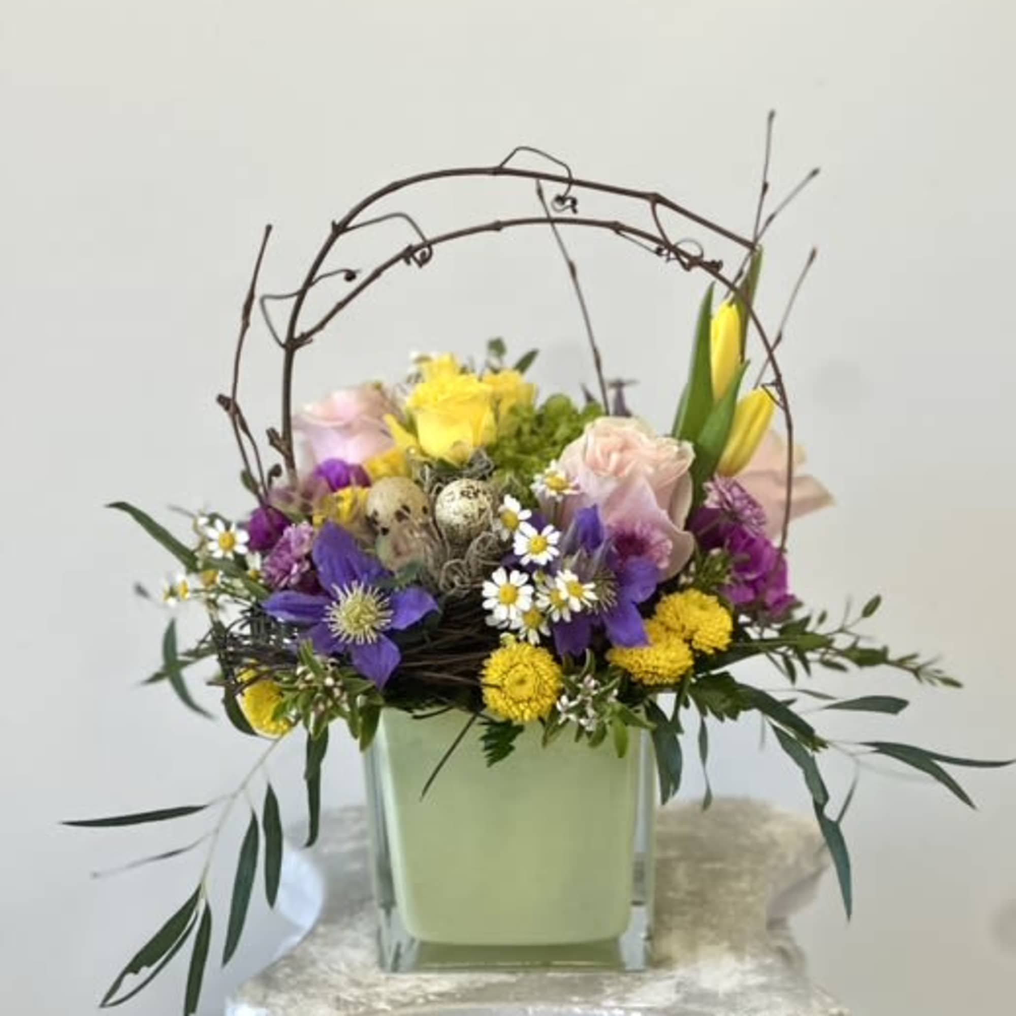 Elevate your Easter celebrations with the Pastel Easter Arrangement by Westford Florist