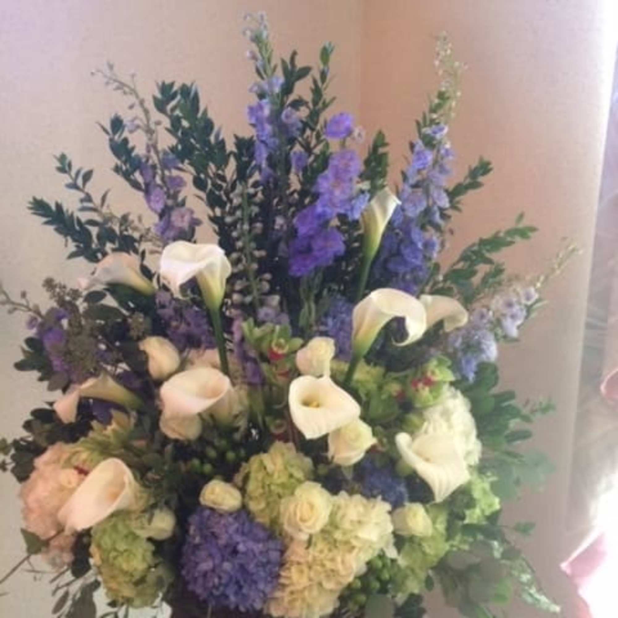 Tall floral arrangement with white calla lilies and purple blooms, photo 2 of 2