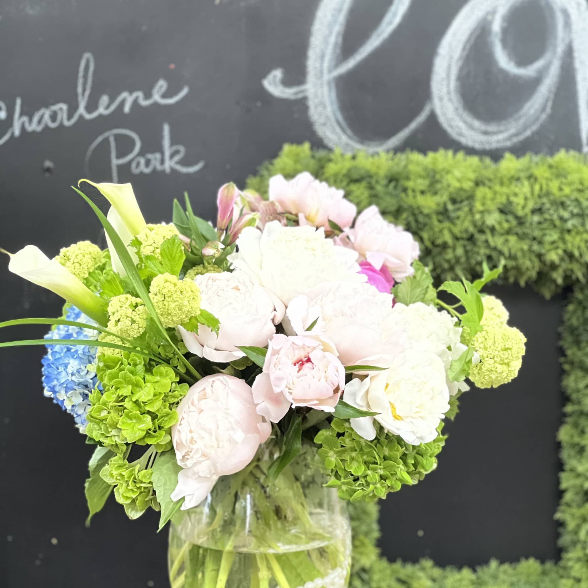 Mixed pastel bouquet in a clear glass vase