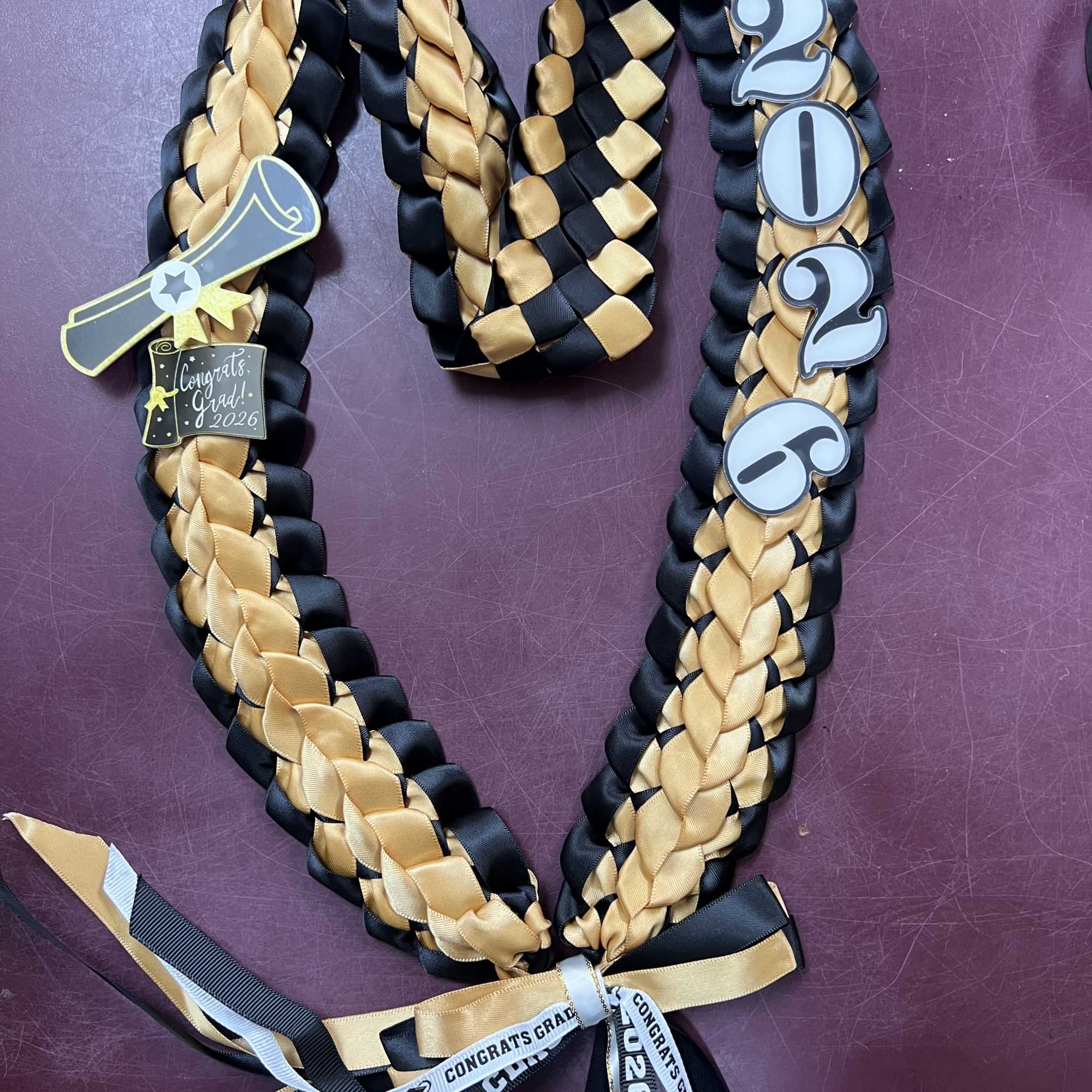 This listing is for the RIBBON LEI ONLY. Cash is not included.
This, photo 2 of 3