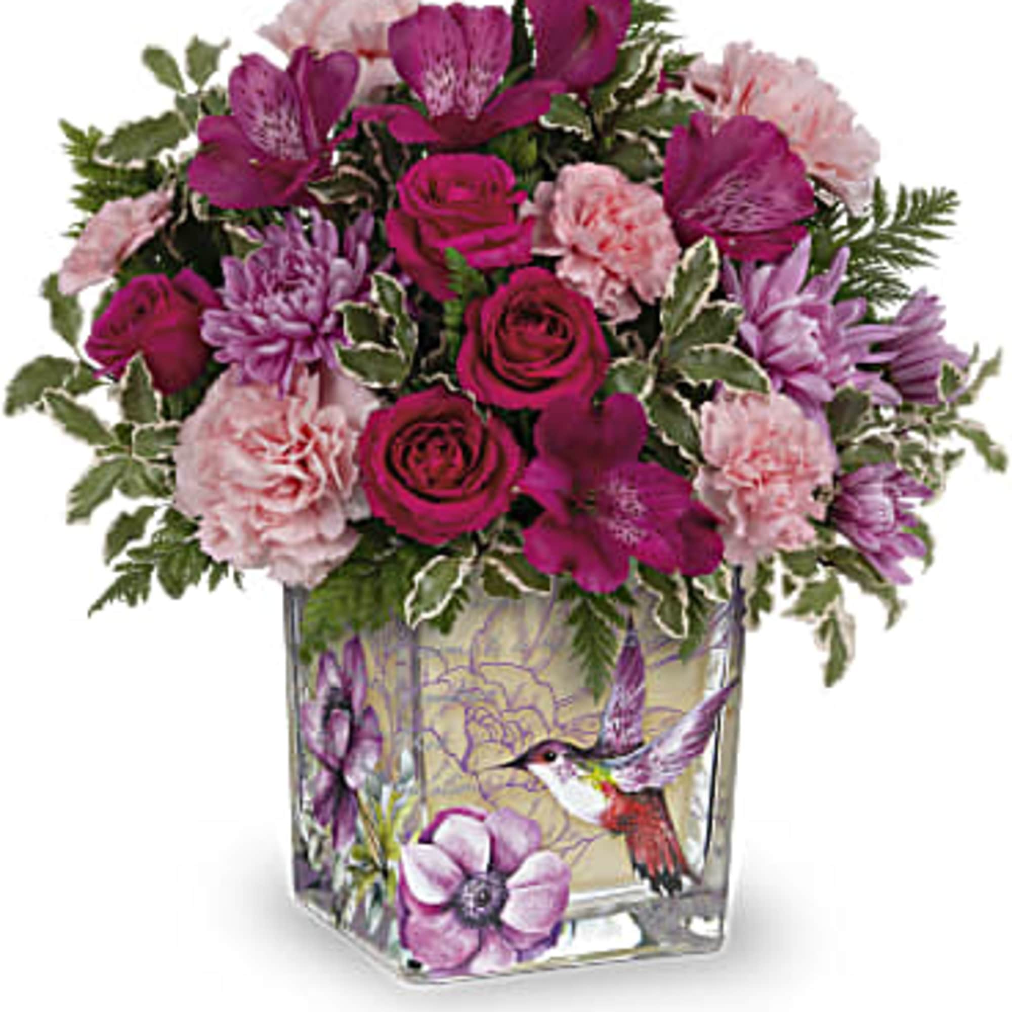 Pink and purple mixed bouquet in a square glass vase