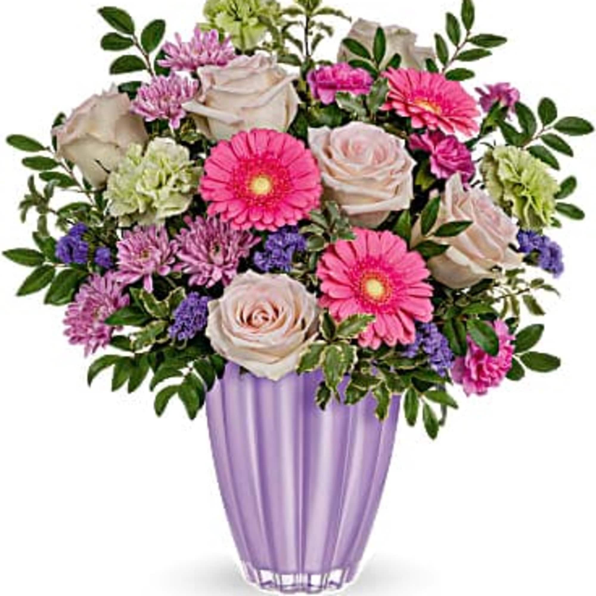 Mixed pink and lavender flowers in a purple vase