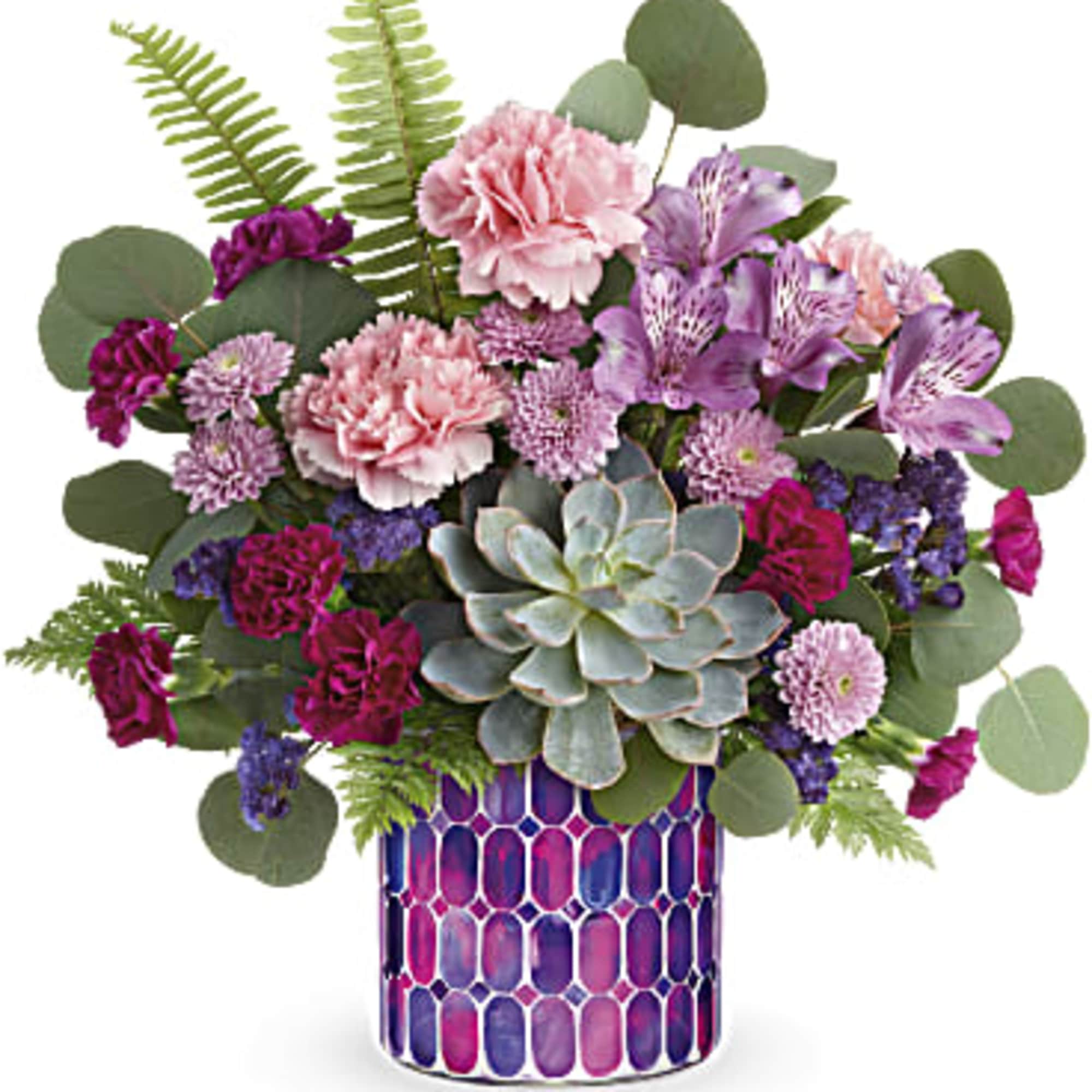 Mixed pink and purple bouquet in a patterned vase with a succulent centerpiece