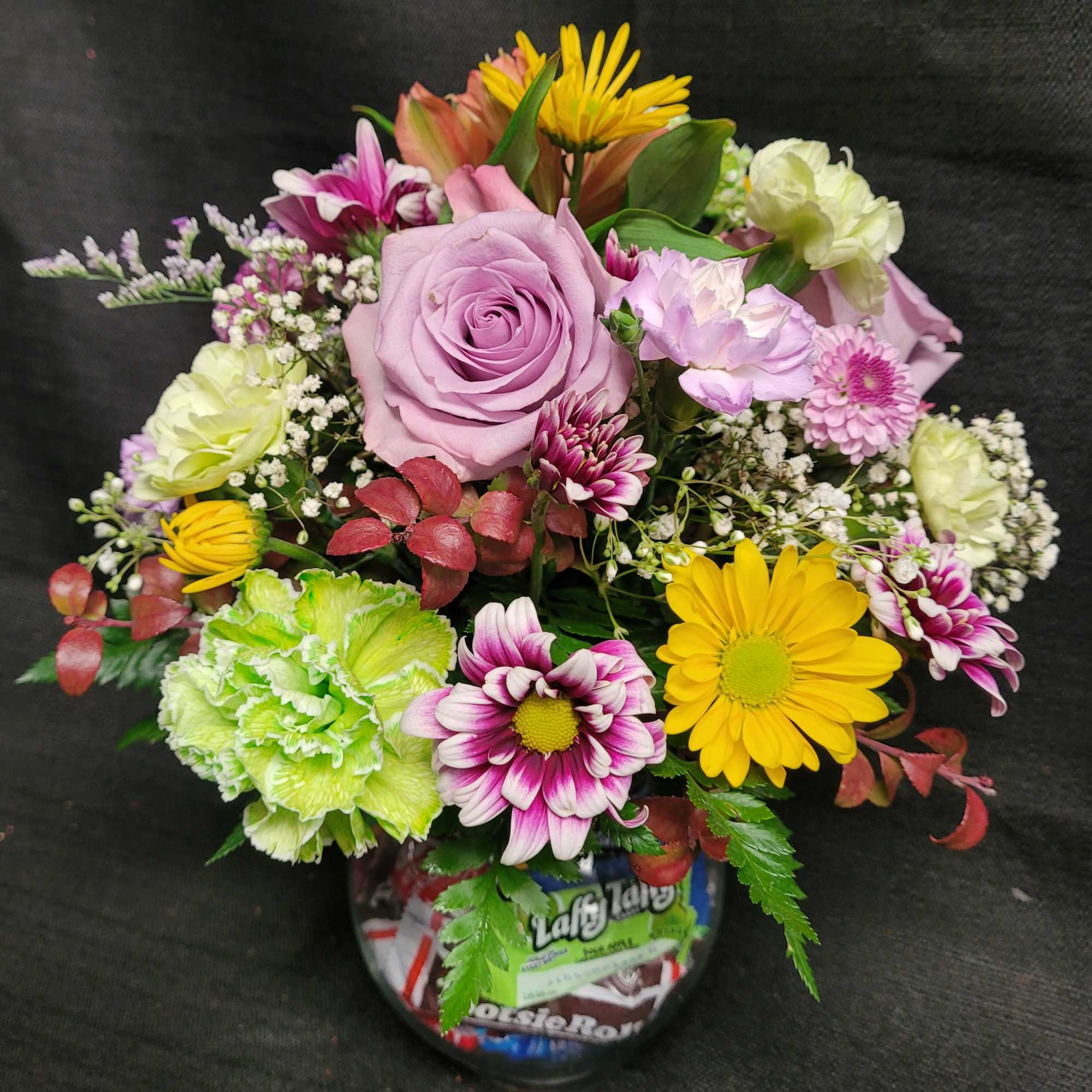 A cheerful mixed-color flower arrangement, making it a joyful choice for a
