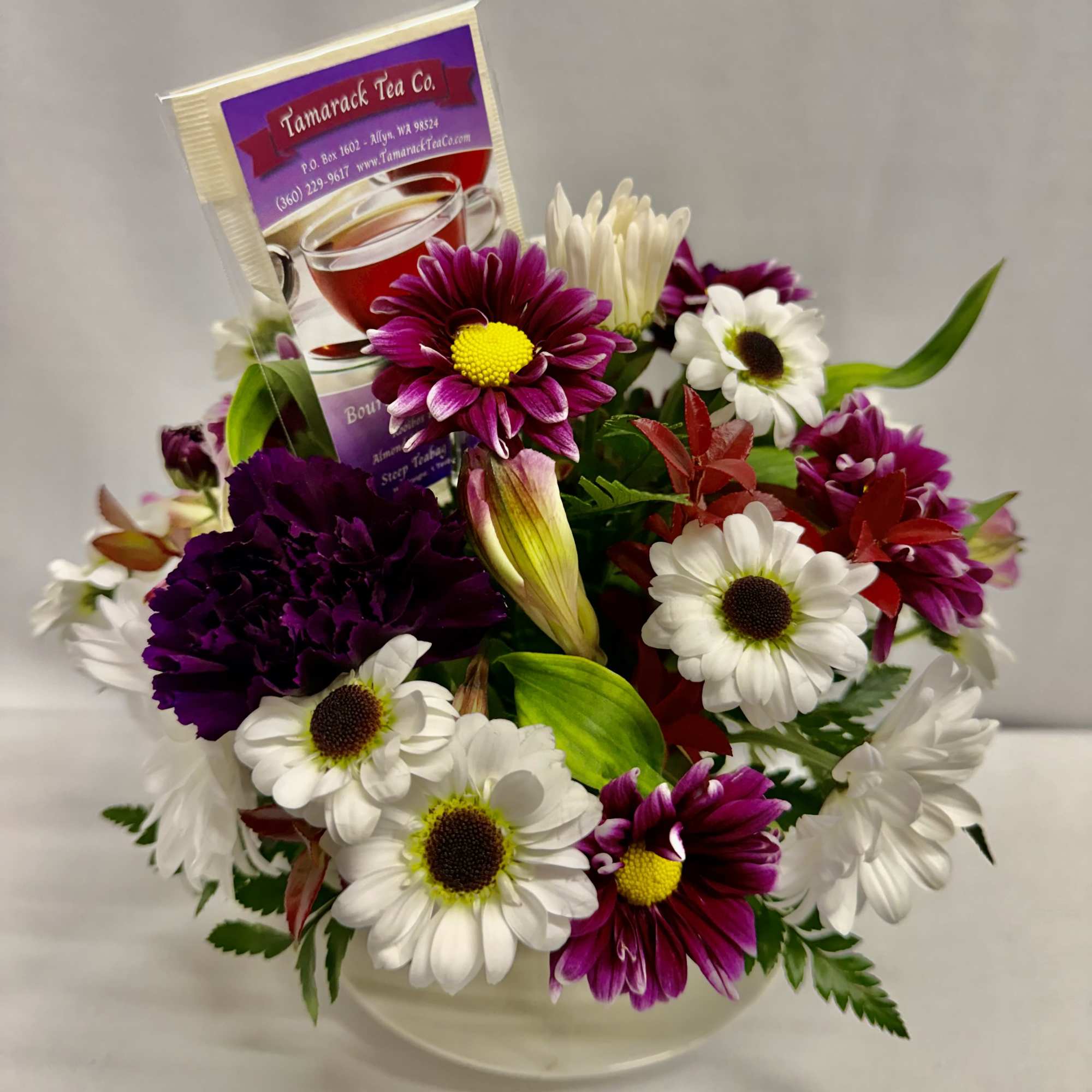 A cozy cluster of mixed roses, daisies, alstroemeria and chrysanthemums arranged in, photo 3 of 5