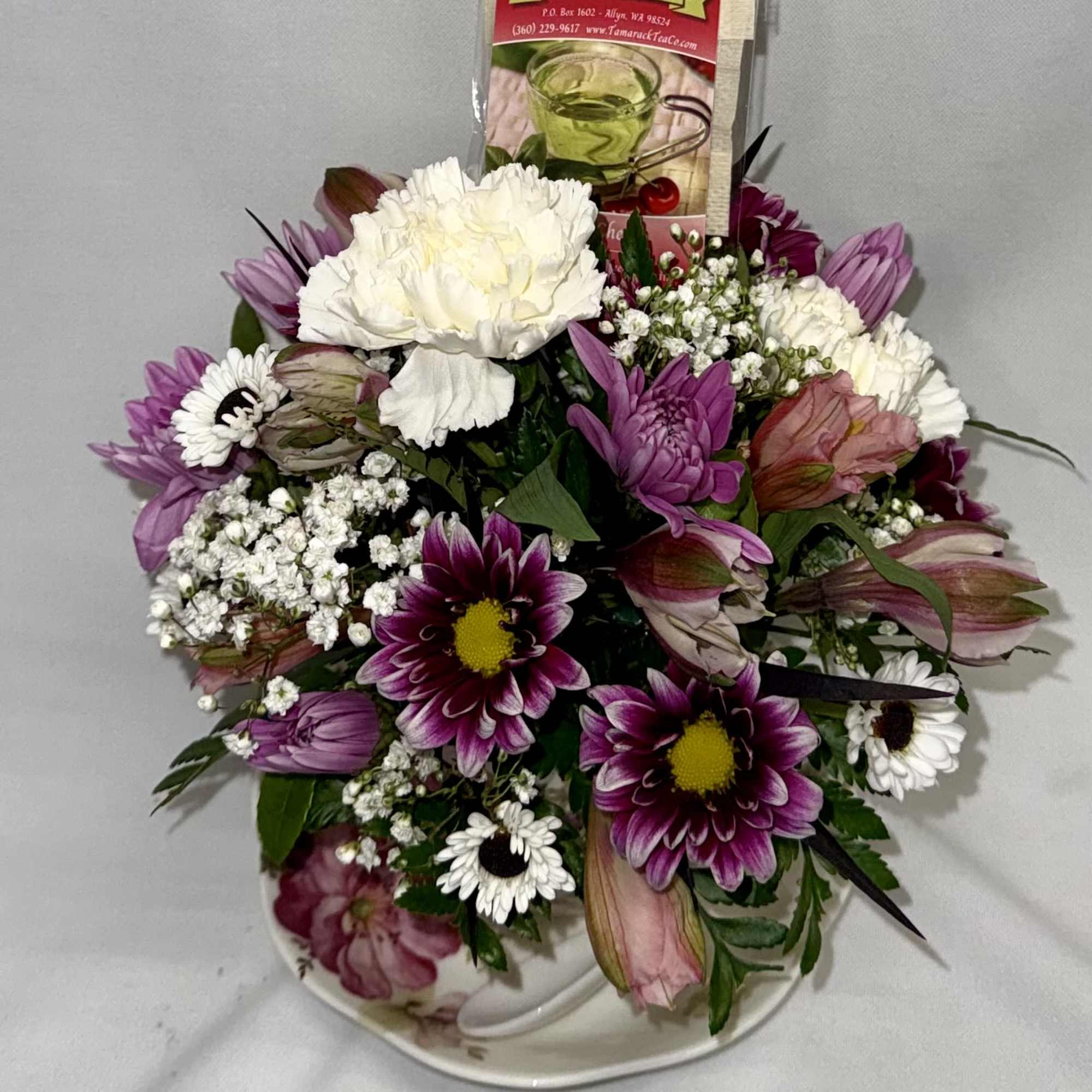A cozy cluster of mixed roses, daisies, alstroemeria and chrysanthemums arranged in, photo 2 of 5