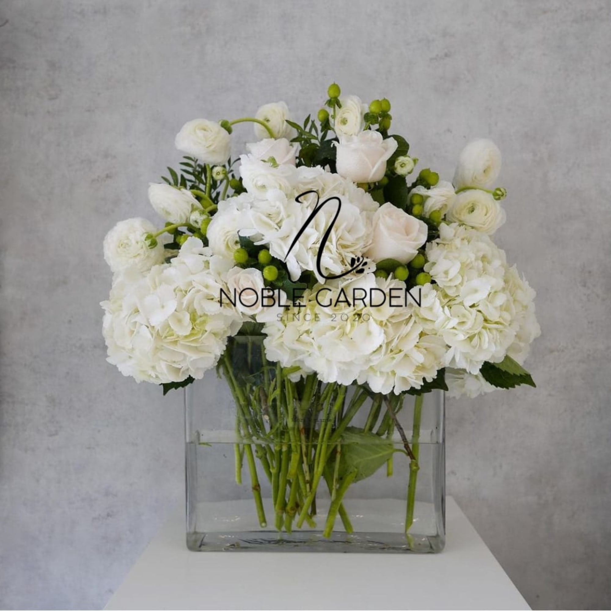 White floral arrangement in a clear glass vase