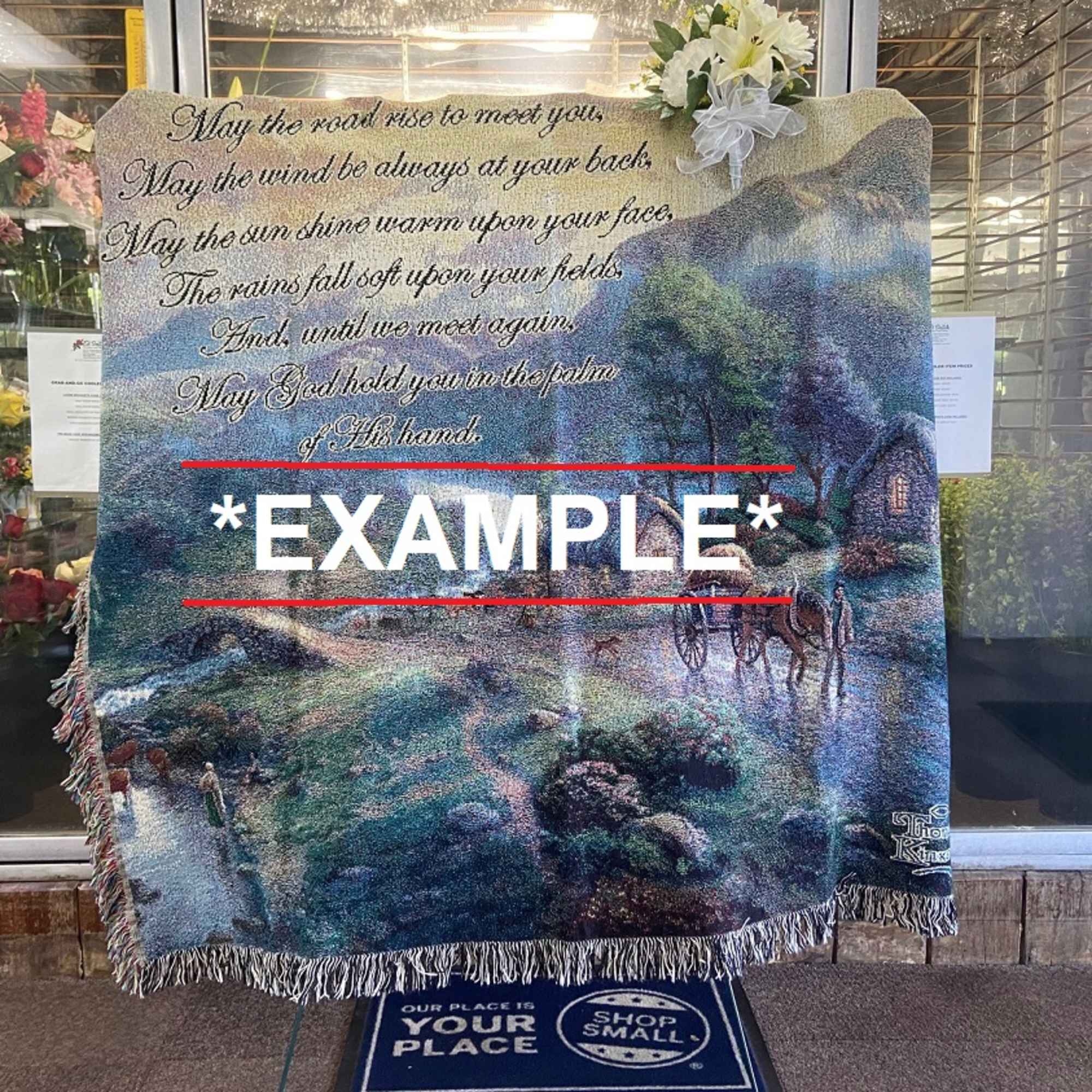 Memorial blanket with a scenic landscape and floral accent
