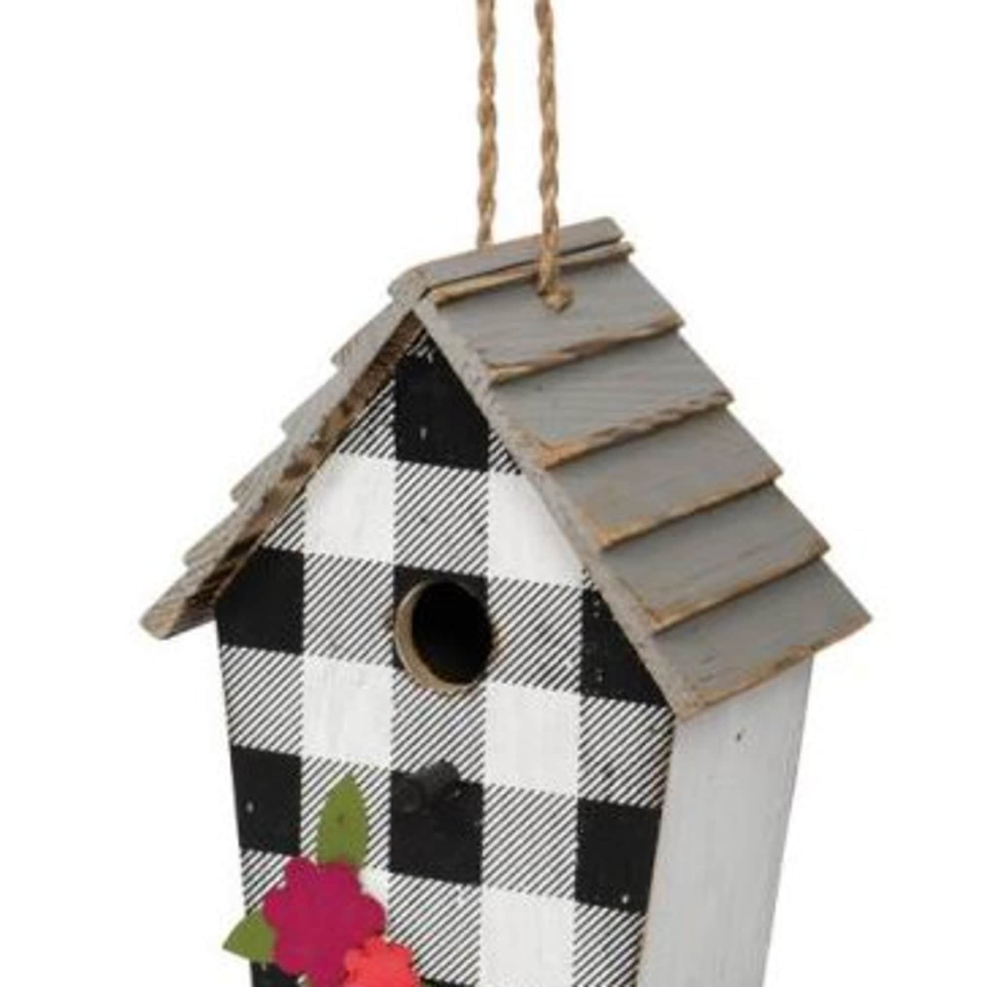 Decorative wooden birdhouse with black-and-white check pattern and flower accents