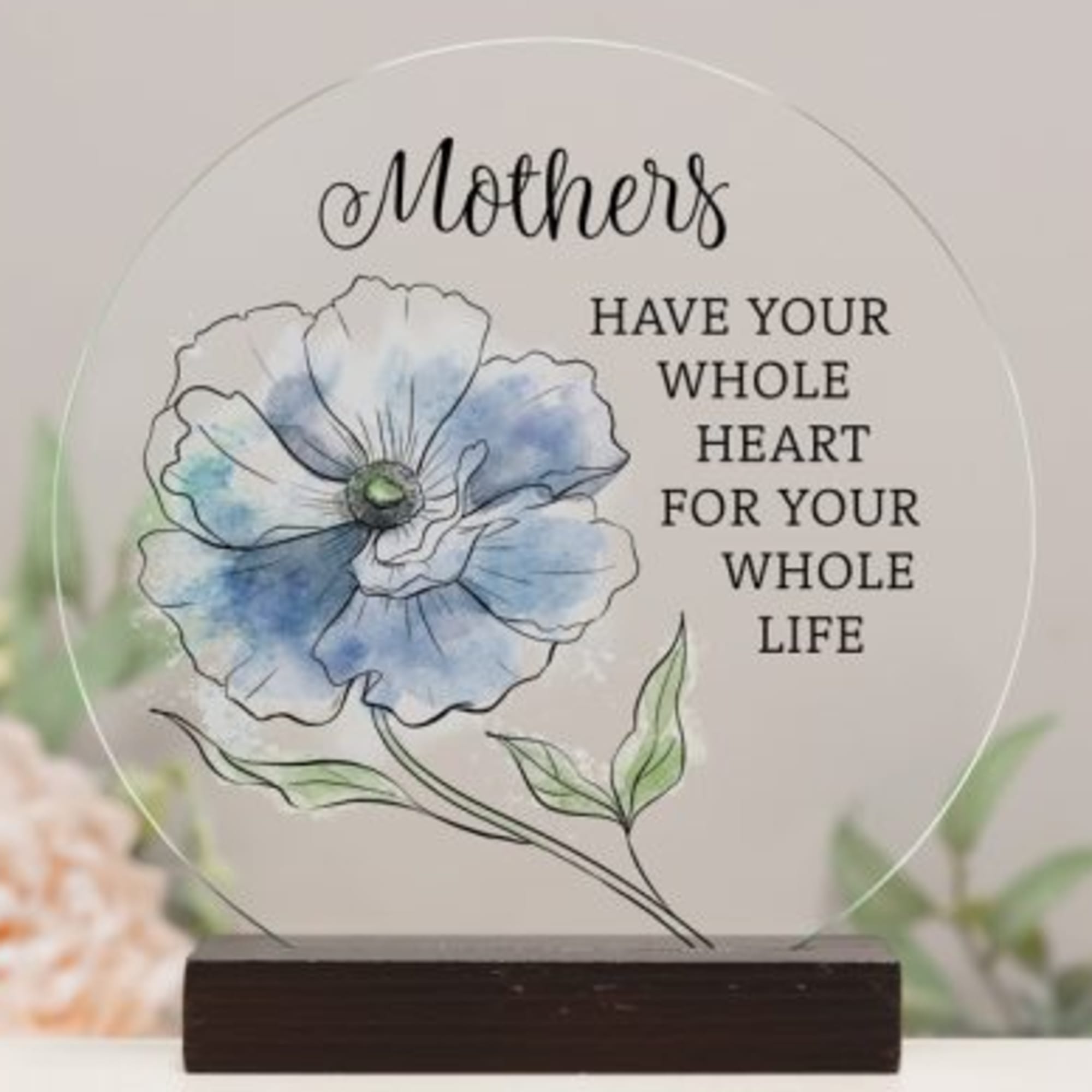 Round glass plaque with a blue flower illustration and Mother's quote
