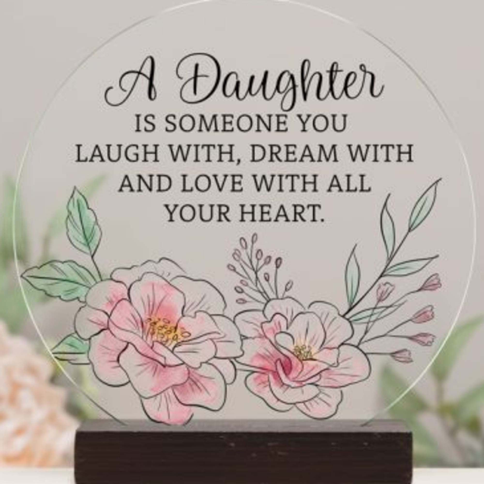 Decorative plaque with floral illustration and daughter quote on a wooden base