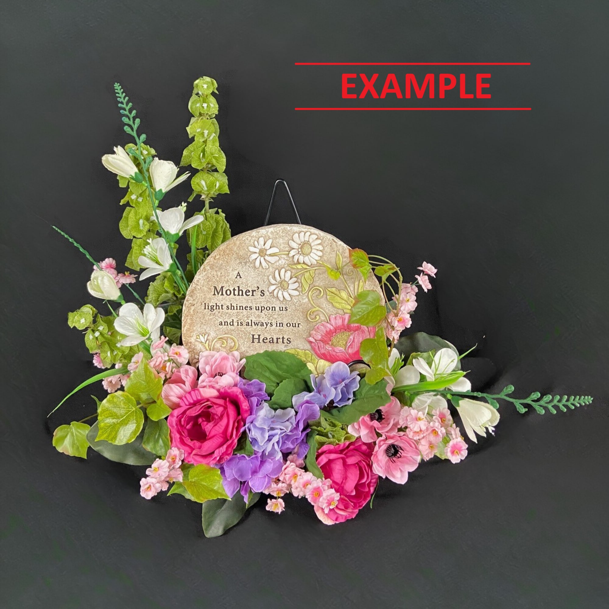Floral wall plaque with pink, purple, white, and green flowers
