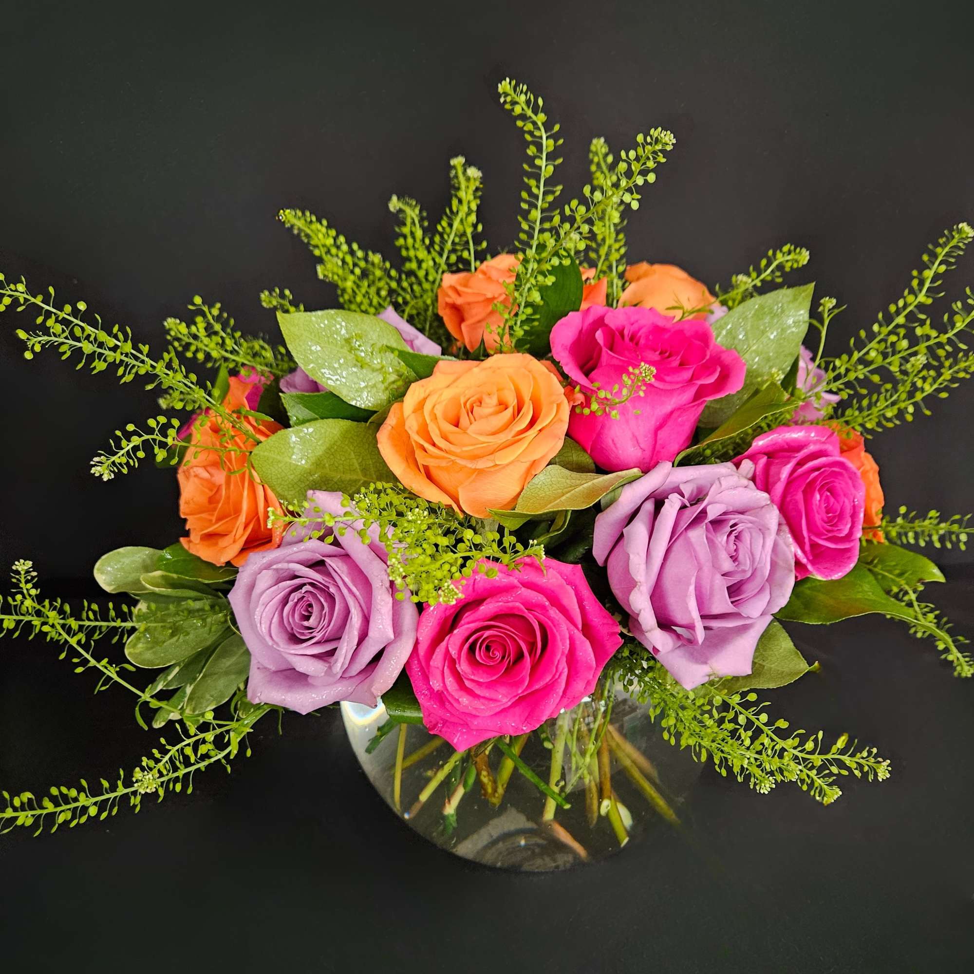 A lovely bowl of colorful roses brightens and lifts any room (and