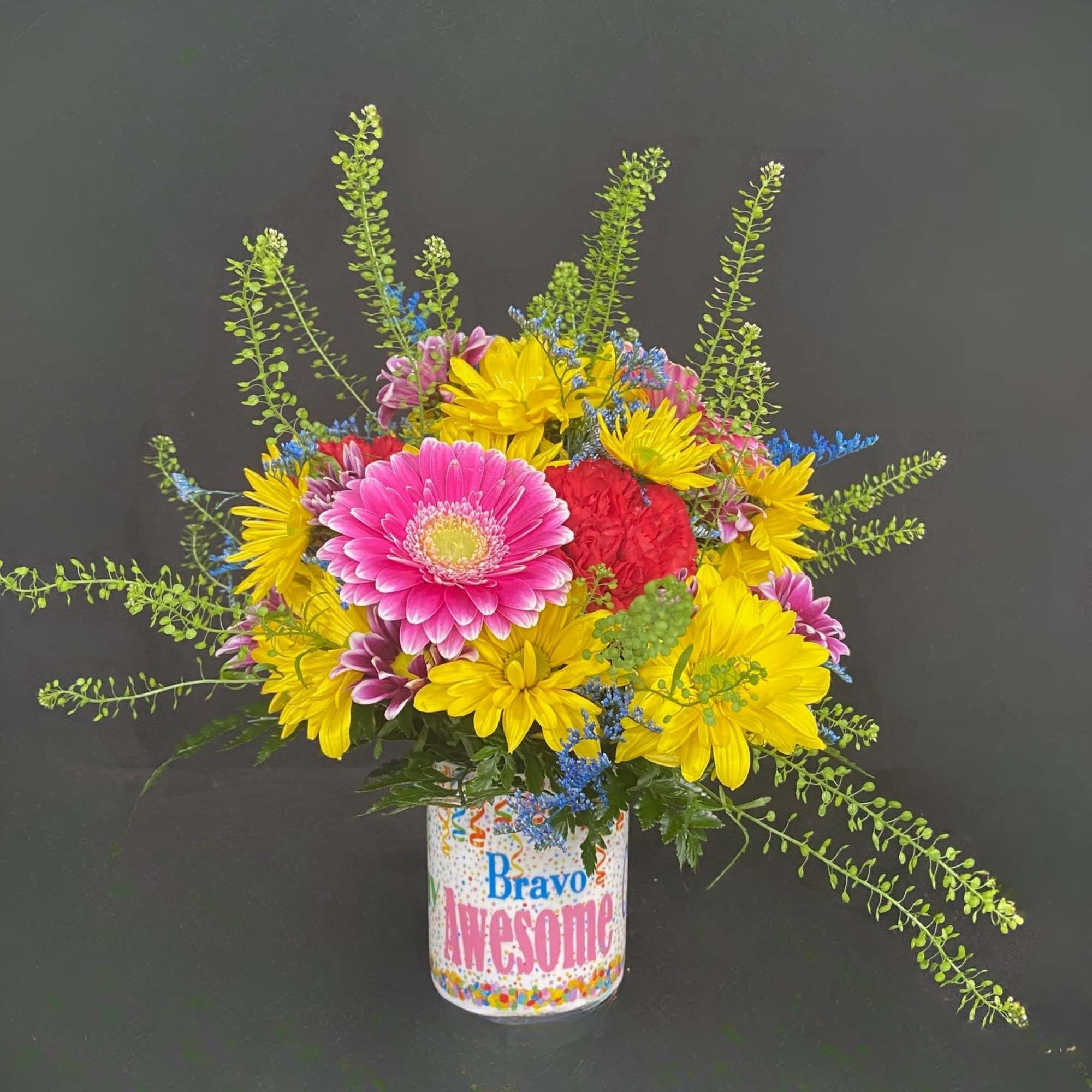 Bright mixed bouquet in a decorated can vase