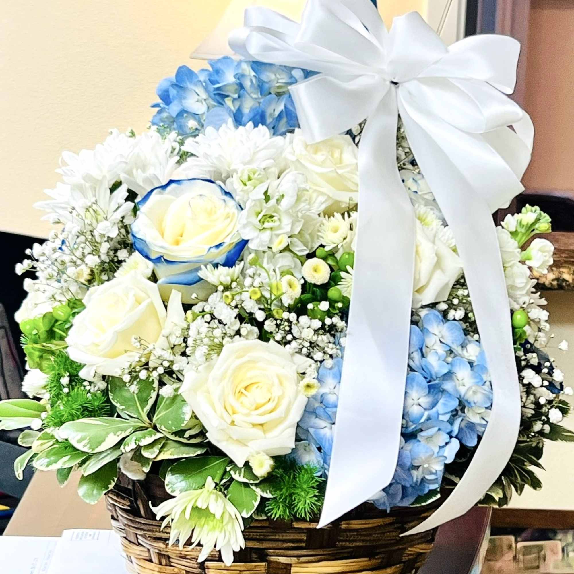 In the somber embrace of loss, the funeral basket stands as a