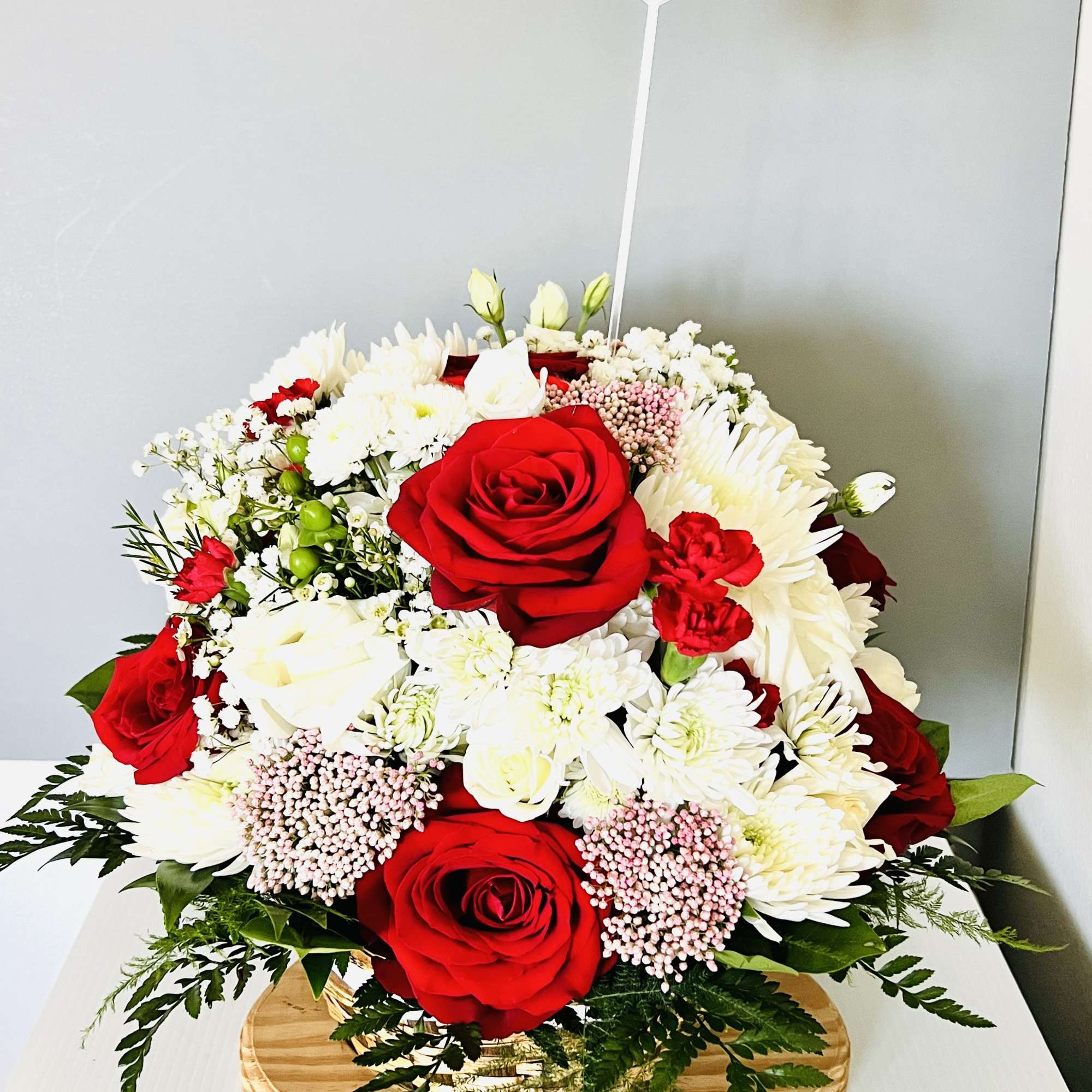 In the somber embrace of loss, the funeral basket stands as a