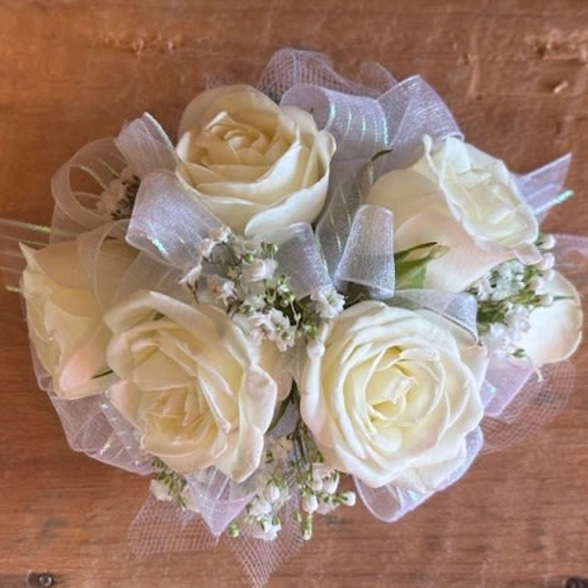 Bouquet of white roses with sheer ribbon accents
