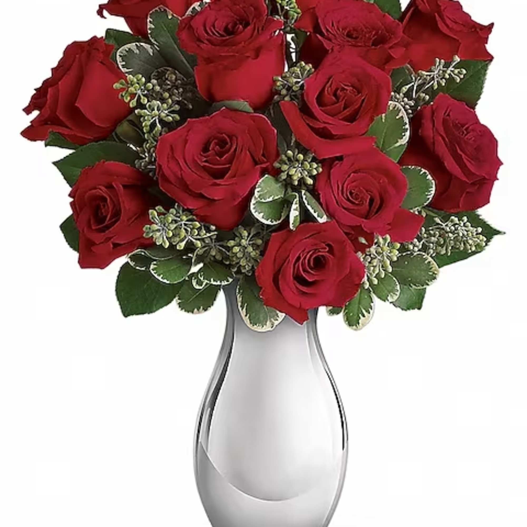 Red roses arranged in a clear glass vase