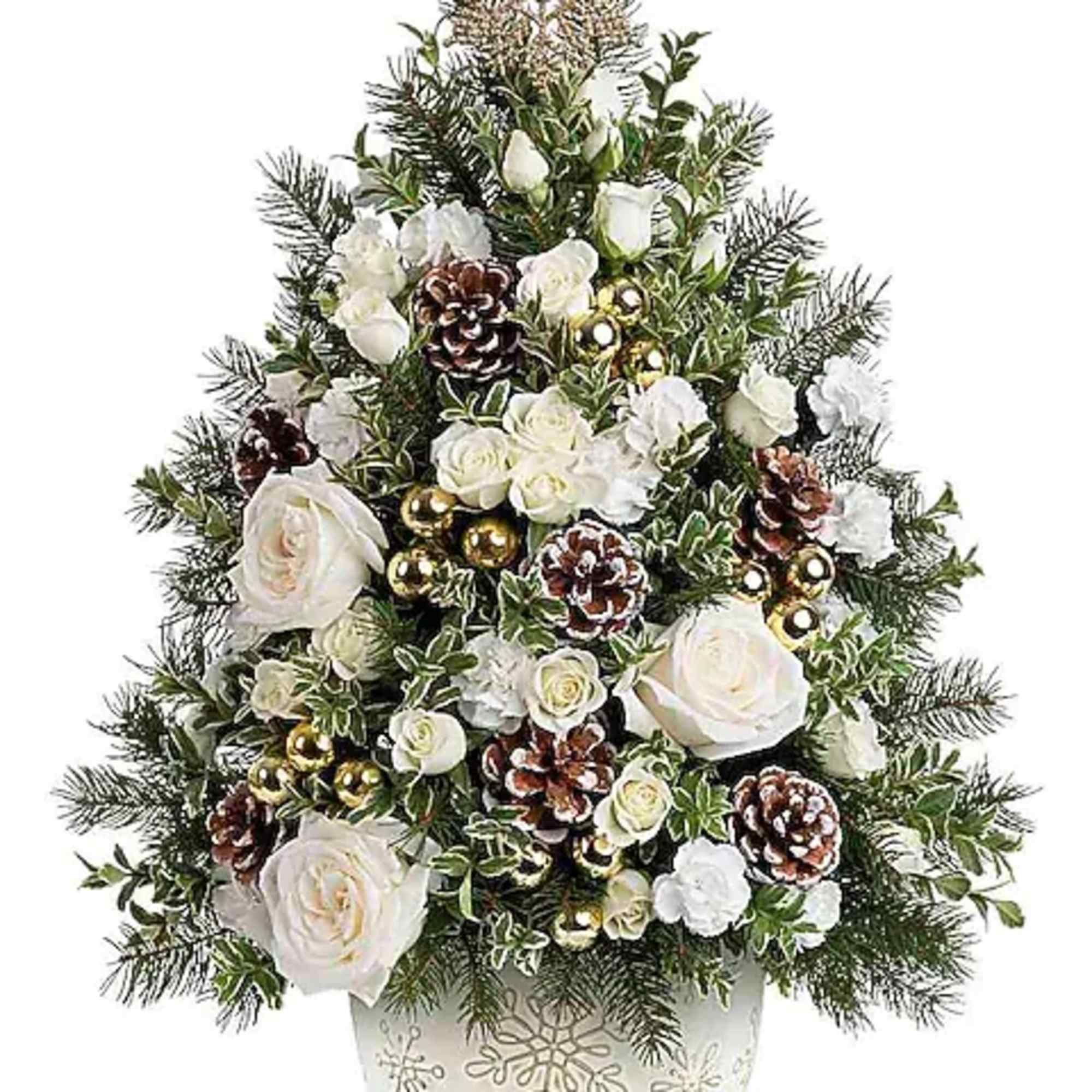 White roses and pinecones arranged in a Christmas tree shape in a decorative pot