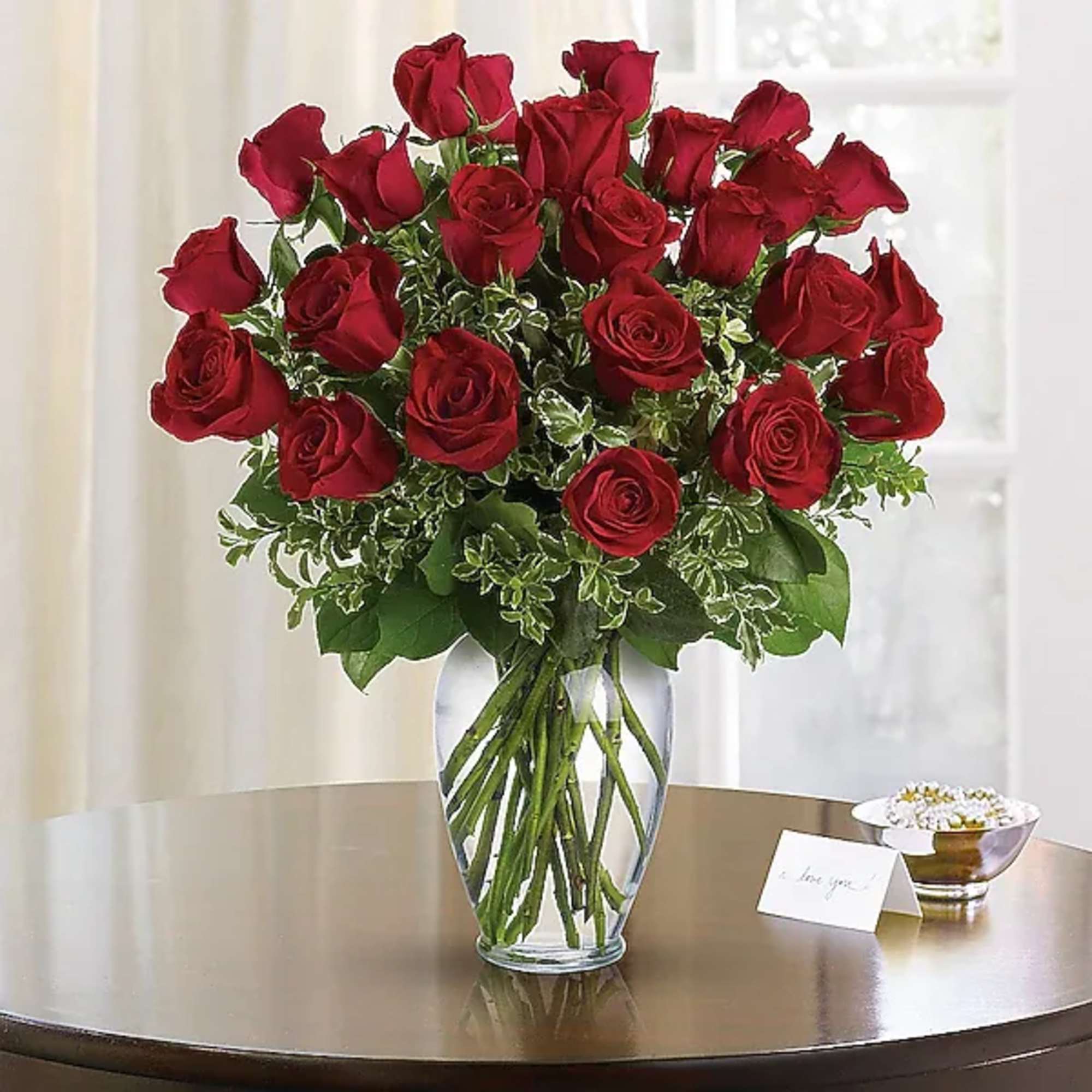 Bouquet of red roses in a clear glass vase